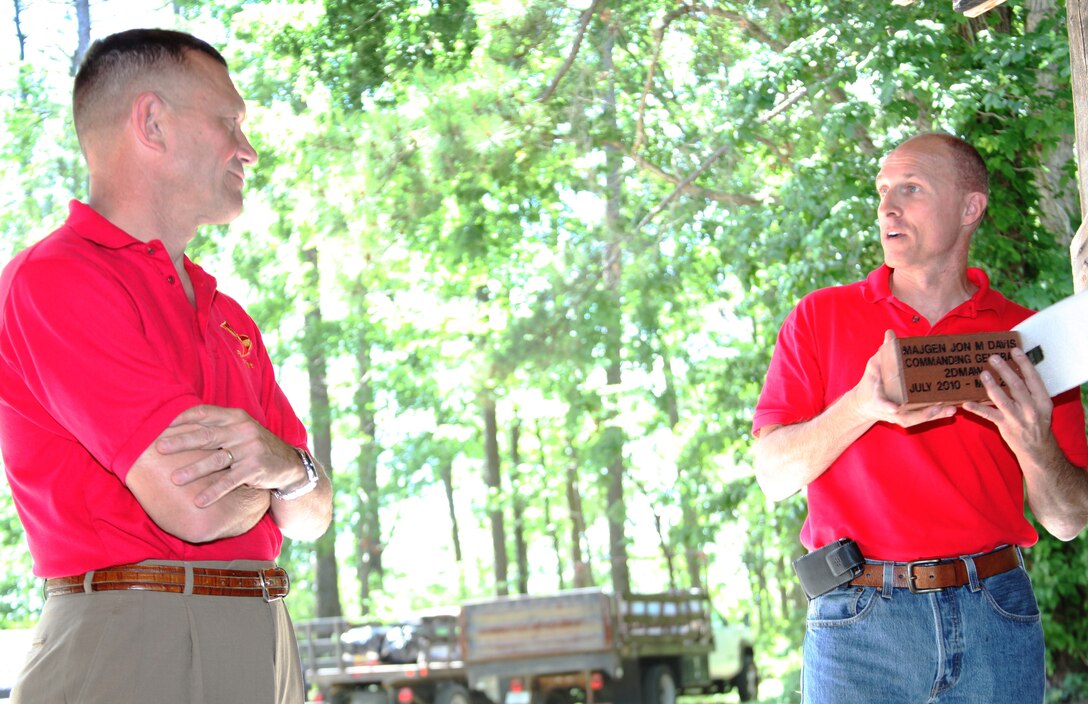 Lt. Col. Thomas J. Witczak, right, commanding officer of Marine Wing Headquarters Squadron 2, presents Maj. Gen. Jon M. Davis, left, the commanding general of the 2nd Marine Aircraft Wing, with tokens of appreciation for nearly two years of leadership at a picnic aboard MCAS Cherry Point, May 8.