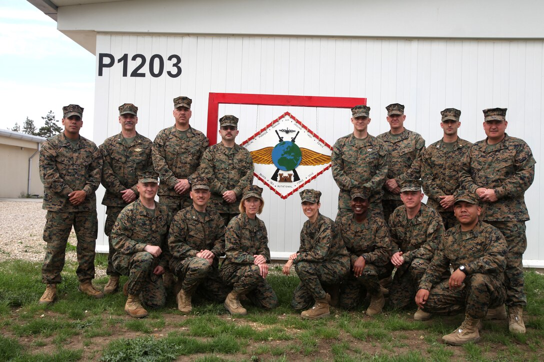 The Marines and sailors of Black Sea Rotational Force 12, pictured here, rescued a Romanian family of four including an infant from a car crash that left the road during inclement weather. The servicemembers were returning from a marathon in Transylvania when they came upon the accident that left the family trapped down a steep embankment. ::r::::n::Group picture:::r::::n::Back row; (Petty Officer Third Class Girien Salazar), (Captain James Flood), (Sgt. Maj. Gary Jacobs), (Master Sgt. Todd Gunter), (Lieutenant Paul Evans), (Lieutenant Derek Owens), (First Sgt. Brian Porter).::r::::n::Front row; (Gunnery Sgt. Andrew Morgan), (Commander Jonathan Kuehne), (Chief Petty Officer Kathy Canady), (Staff Sgt. Darla Richardson), (Staff Sgt. Enid Browne), (Chief Warrant Officer 2 Adrian Weaver), (Gunnery Sgt. Juan Delacruz).::r::::n::