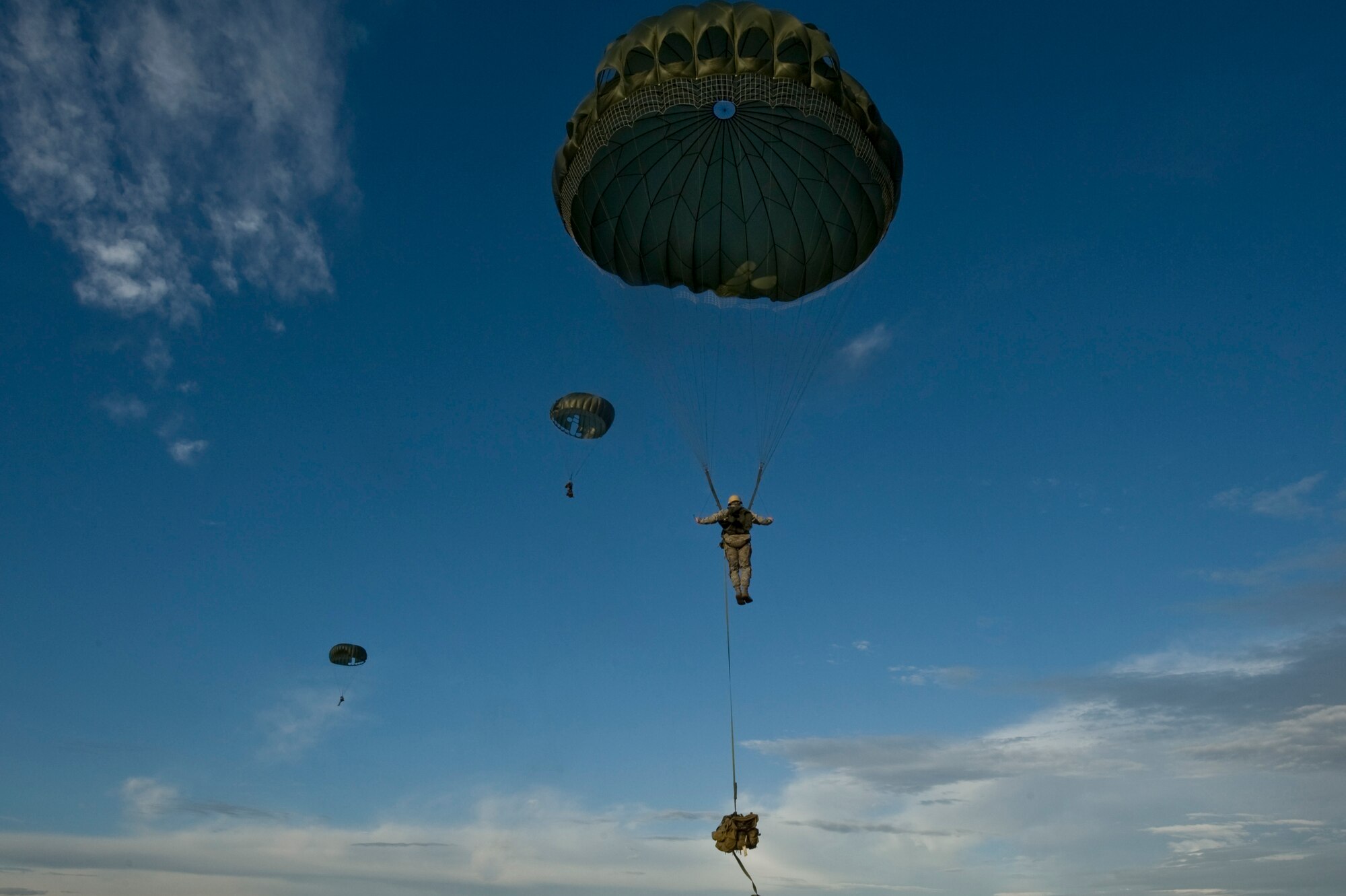 Members of the U.S. Air Force 820th RED HORSE Squadron airborne flight parachute during a training mission, April 26, 2012, at Nellis Air Force Base, Nev. RED HORSE airman can reach otherwise inaccessible locations via air-drop. (U.S. Air Force photo by Airman 1st Class Daniel Hughes)
