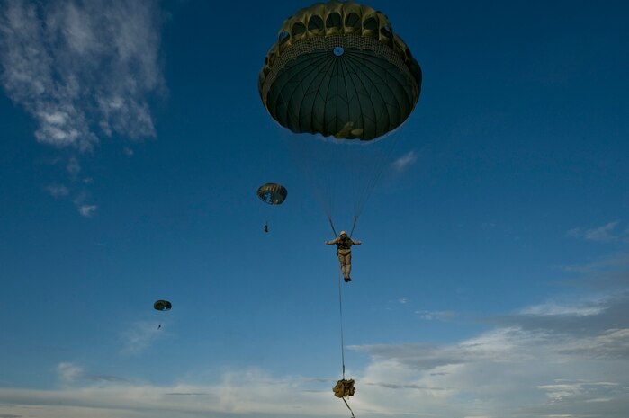 Members of the U.S. Air Force 820th RED HORSE Squadron airborne flight parachute during a training mission, April 26, 2012, at Nellis Air Force Base, Nev. RED HORSE airman can reach otherwise inaccessible locations via air-drop. (U.S. Air Force photo by Airman 1st Class Daniel Hughes)