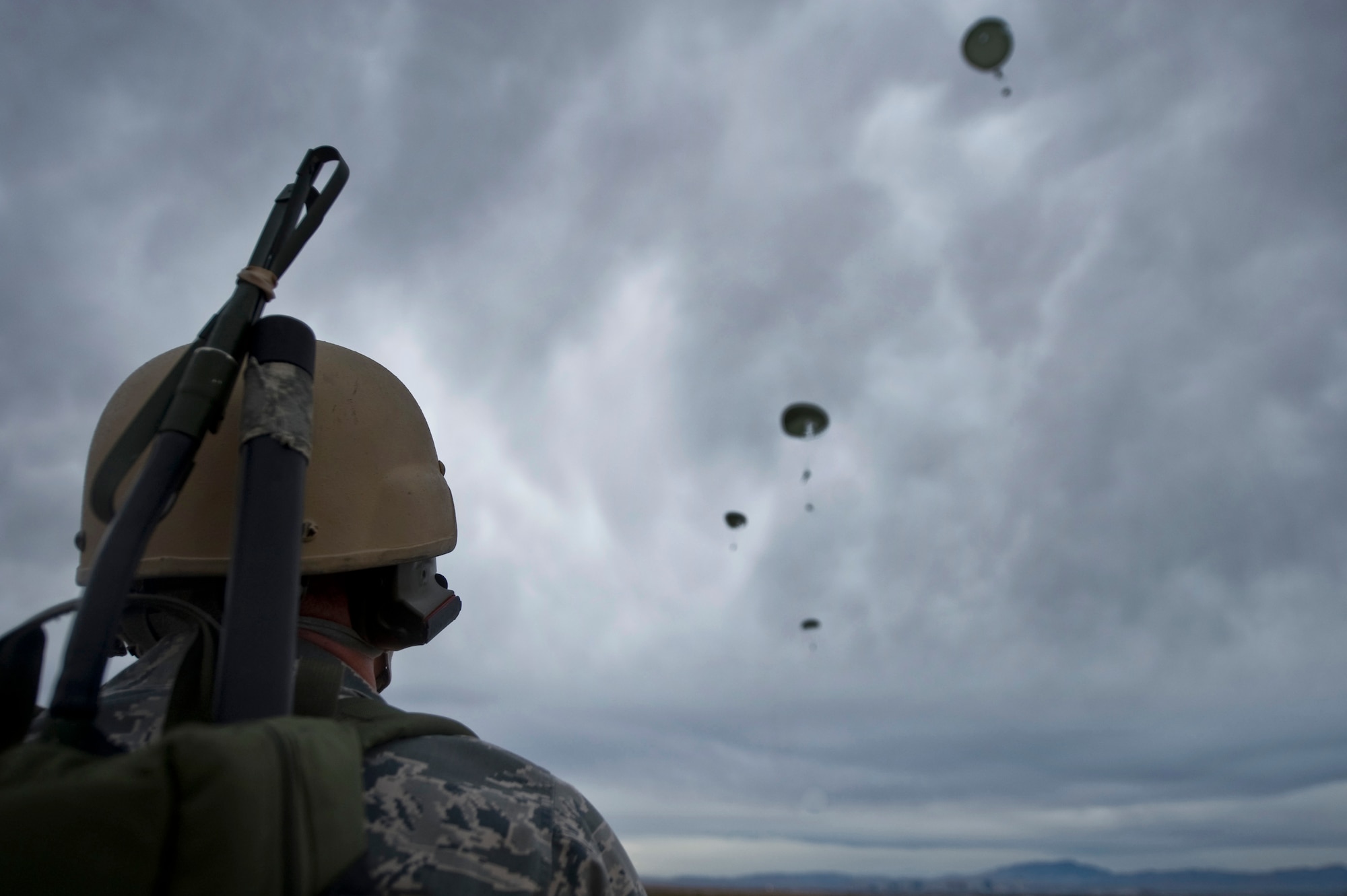 U.S. Air Force Tech. Sgt. Kellen Buss, 820th RED HORSE Squadron airborne flight water and fuels systems maintenance craftsman, reports canopy openings during a training mission, April 25, 2012, at Nellis Air Force Base, Nev. RED HORSE added an airborne capability in 2005. (U.S. Air Force photo by Airman 1st Class Daniel Hughes)
