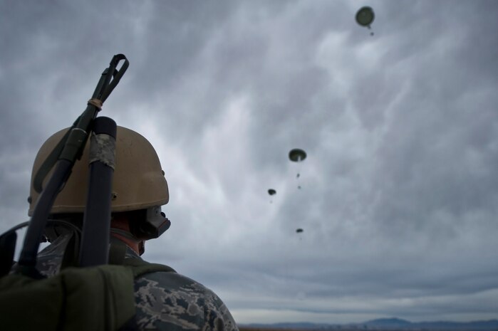 U.S. Air Force Tech. Sgt. Kellen Buss, 820th RED HORSE Squadron airborne flight water and fuels systems maintenance craftsman, reports canopy openings during a training mission, April 25, 2012, at Nellis Air Force Base, Nev. RED HORSE added an airborne capability in 2005. (U.S. Air Force photo by Airman 1st Class Daniel Hughes)