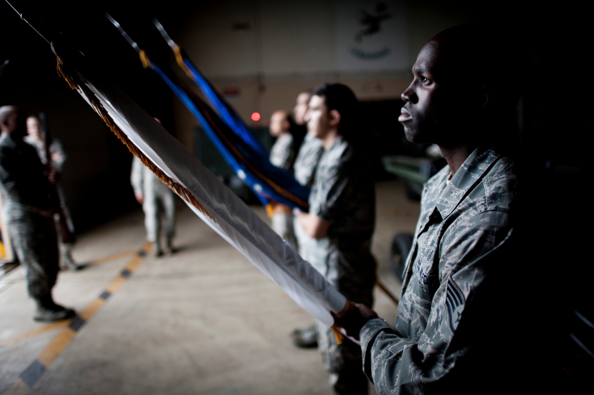 YOKOTA AIR BASE, Japan -- Staff Sgt. Shane Polk, Yokota Honor Guard recruit, practices port arms with a flag staff during a training session at Yokota Air Base, Japan, May 3, 2012. Upon successful completion of training, Polk was selected for the base honor guard team. (U.S. Air Force photo by Staff Sgt. Samuel Morse)