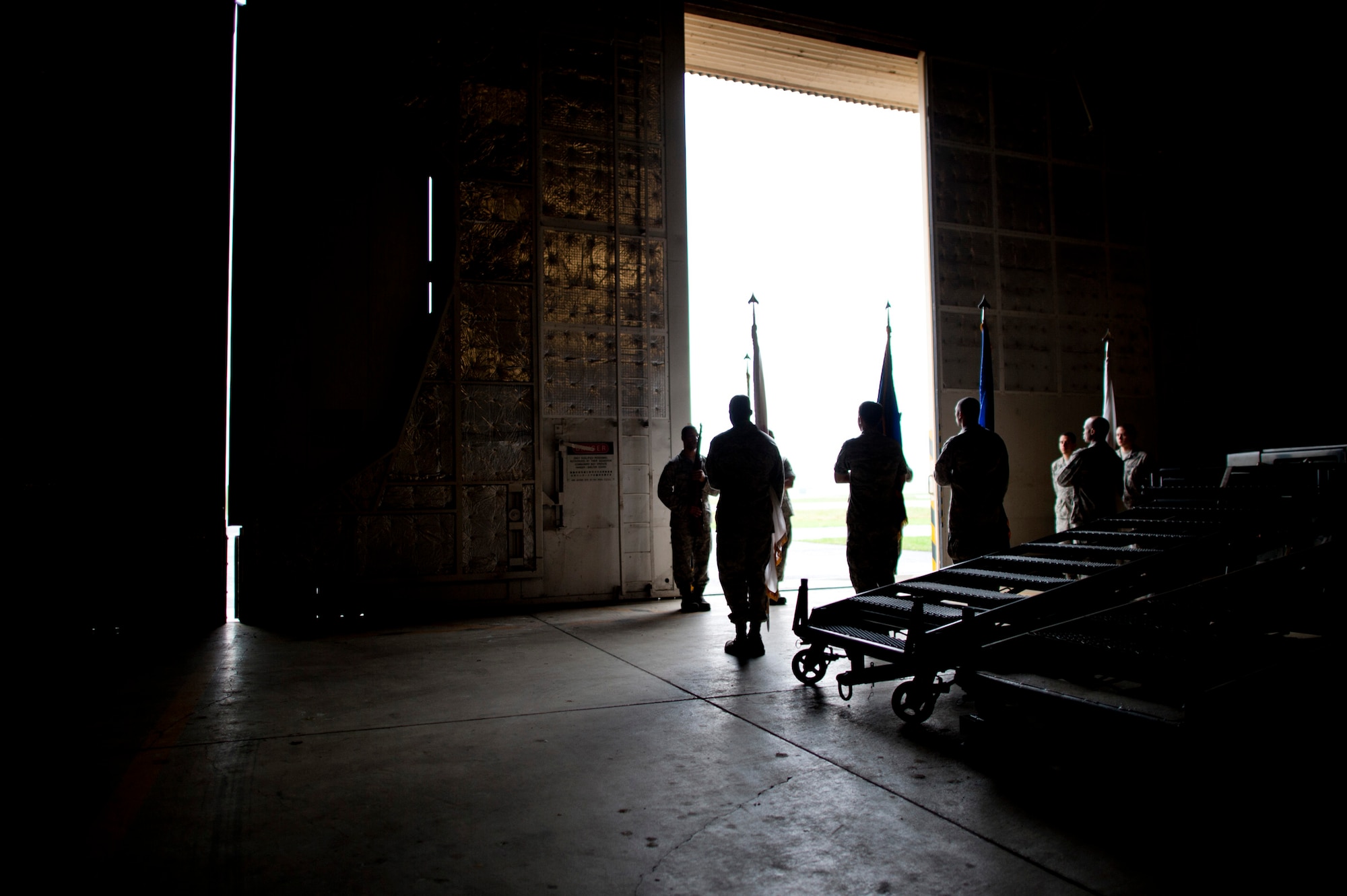 YOKOTA AIR BASE, Japan -- Yokota Honor Guard recruits learn how to handle flag staffs in a hangar during a week-long training session at  Yokota Air Base, Japan, May 3, 2012. (U.S. Air Force photo by Staff Sgt. Samuel Morse)