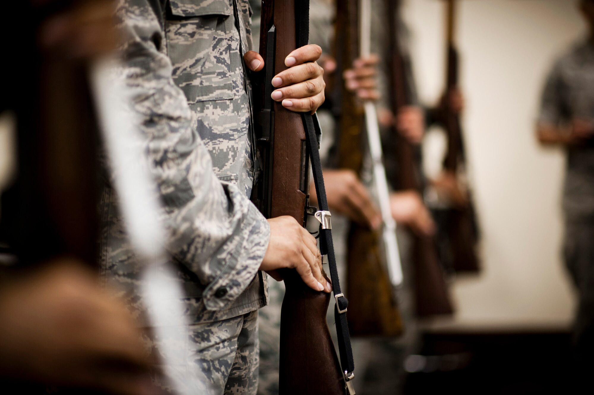YOKOTA AIR BASE, Japan -- Yokota Honor Guardsmen hold rifles at the position of present arms during a week-long training session at Yokota Air Base, Japan, May 1, 2012. (U.S. Air Force photo by Staff Sgt. Samuel Morse)