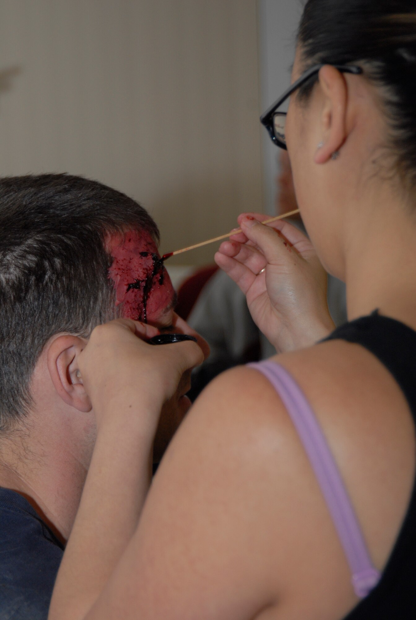 Moulage kits were used in preparation for the active shooter response scenario May 2, during the installation exercise, Ardent Sentry 2012. The moulage kits add a dimension of realism during the exercise for the first responders. (Air Force Photo by Laura Mowry)