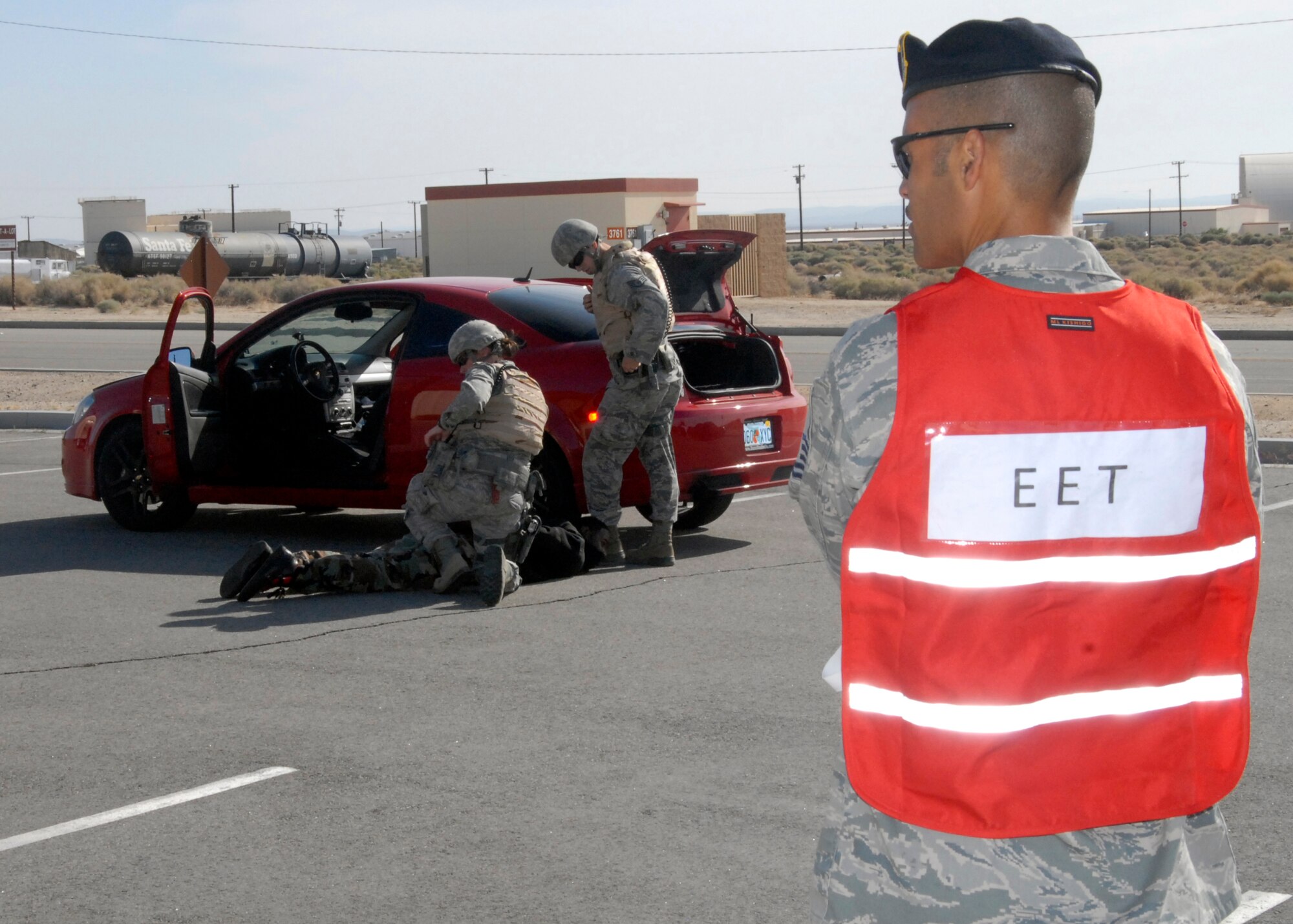 A member of the Edwards Air Force Base Exercise Evaluation Team looks on during the 95th Security Forces Squadron's response to an active shooter scenario during the week-long USNORTHCOM directed exercise, Ardent Sentry 2012. (Air Force Photo by Laura Mowry)