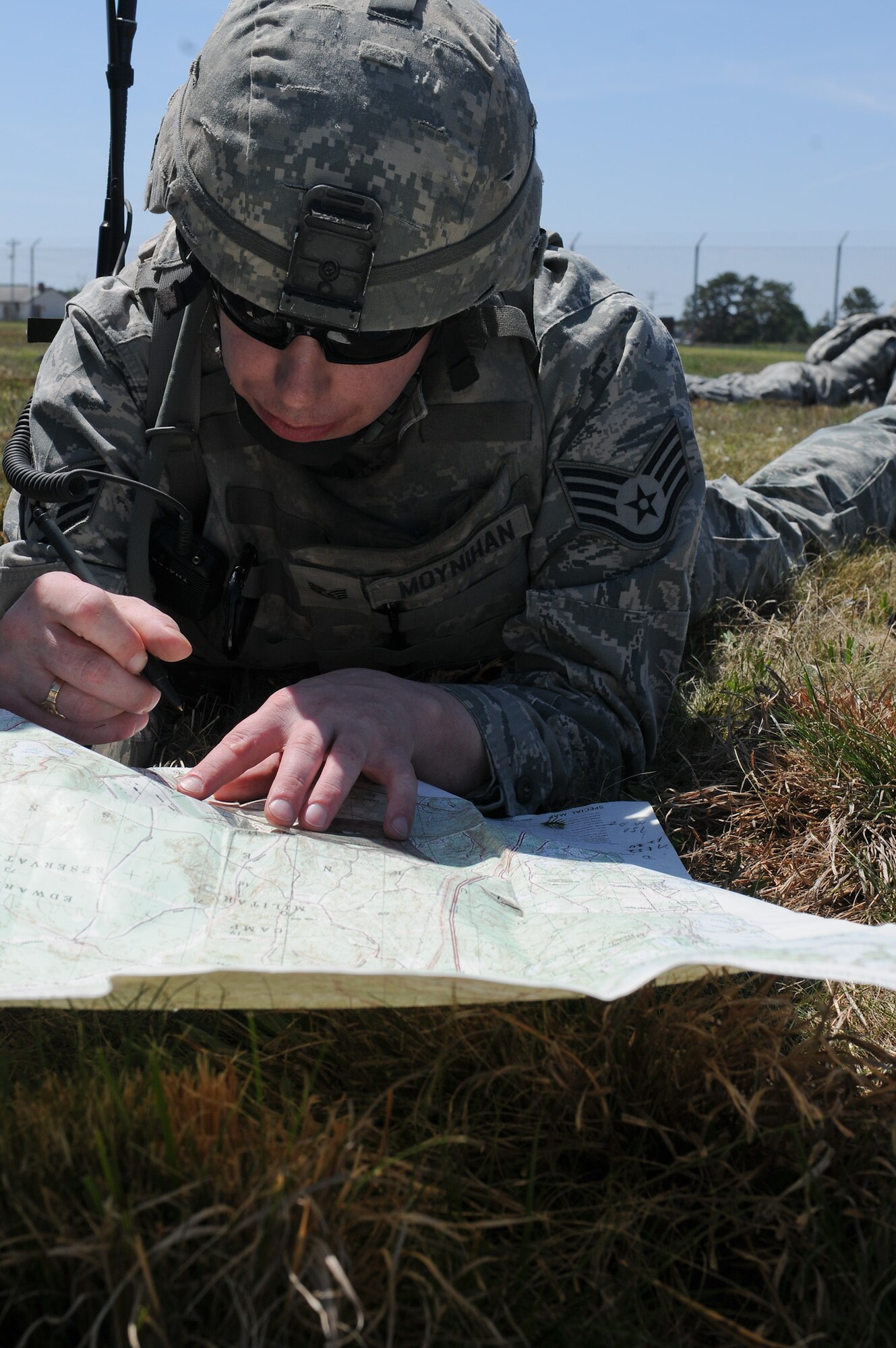 Staff Sgt. Michael Moynihan, 102nd Security Forces Squadron, plots checkpoint coordinates on a map prior to his squad starting its dismounted patrol on Otis Air National Guard Base May 7, 2012. During the dismounted patrol portion of their training, the 102 SFS defenders were tasked with locating and navigating their way to five checkpoints on Otis ANGB while moving tactically in formations.  The 102 SFS defenders spent the day honing their skills in areas such as convoy operations and dismounted patrol procedures in order to keep their proficiency at a high level. (U.S. Air Force photo/ Senior Airman Patrick McKenna)