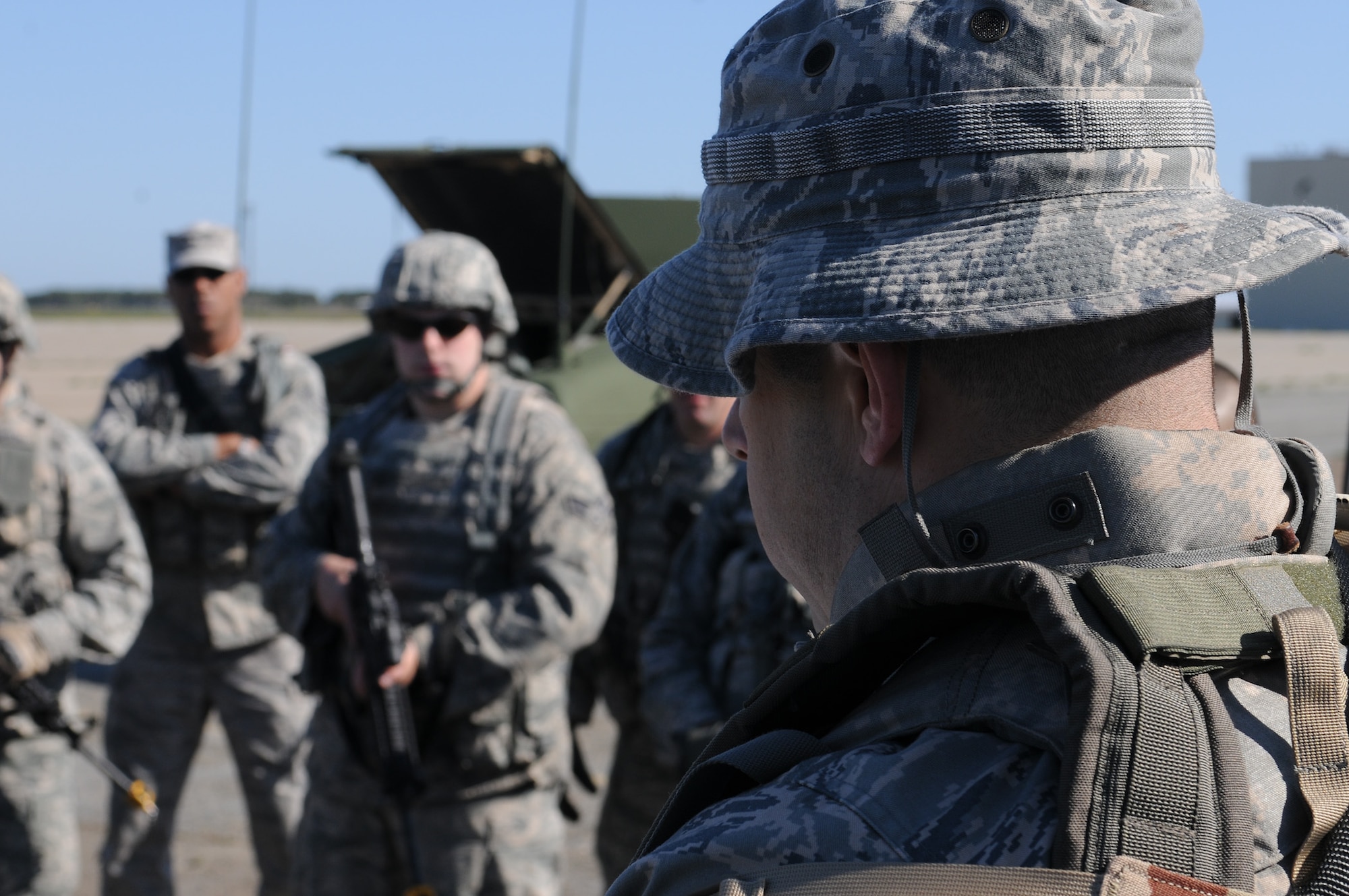 Master Sgt. Paul Stewart, 102nd Security Forces Squadron, gives a mission brief to his squad prior to the convoy operations portion of their annual combat readiness task training on Otis Air National Guard Base May 7, 2012. Stewart provided the Airmen in his convoy an intelligence brief and provided guidance on vehicle assignments, formations and tactics. The 102 SFS defenders spent the day honing their skills in areas such as convoy operations and dismounted patrol procedures in order to keep their proficiency at a high level. (U.S. Air Force photo/ Senior Airman Patrick McKenna)