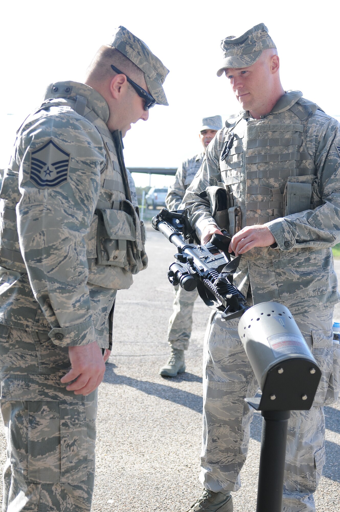 Master Sgt. Nicholas Giammarco, 102nd Security Forces Squadron, inspects Tech. Sgt. Keith Ledin’s M4 ensuring the weapon is on safe and the chamber is clear at a clearing barrel prior to their annual combat readiness task training on Otis Air National Guard Base May 7, 2012. The 102 SFS defenders spent the day honing their skills in areas such as convoy operations and dismounted patrol procedures in order to keep their proficiency at a high level. (U.S. Air Force photo/ Senior Airman Patrick McKenna)