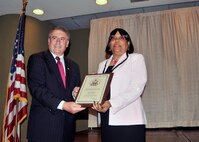 Former 914th Airlift Wing member Mrs. Linda Chapman, U.S. Immigration and Customs Enforcement, receives the Buffalo Federal Executive Board’s Community Service award, May 8, 2012, Buffalo, NY. The Buffalo Federal Executive Board handed out its annual Federal Employees of the Year awards at the Buffalo convention center. (U.S. Air force photo by Tech. Sgt. Joseph McKee)