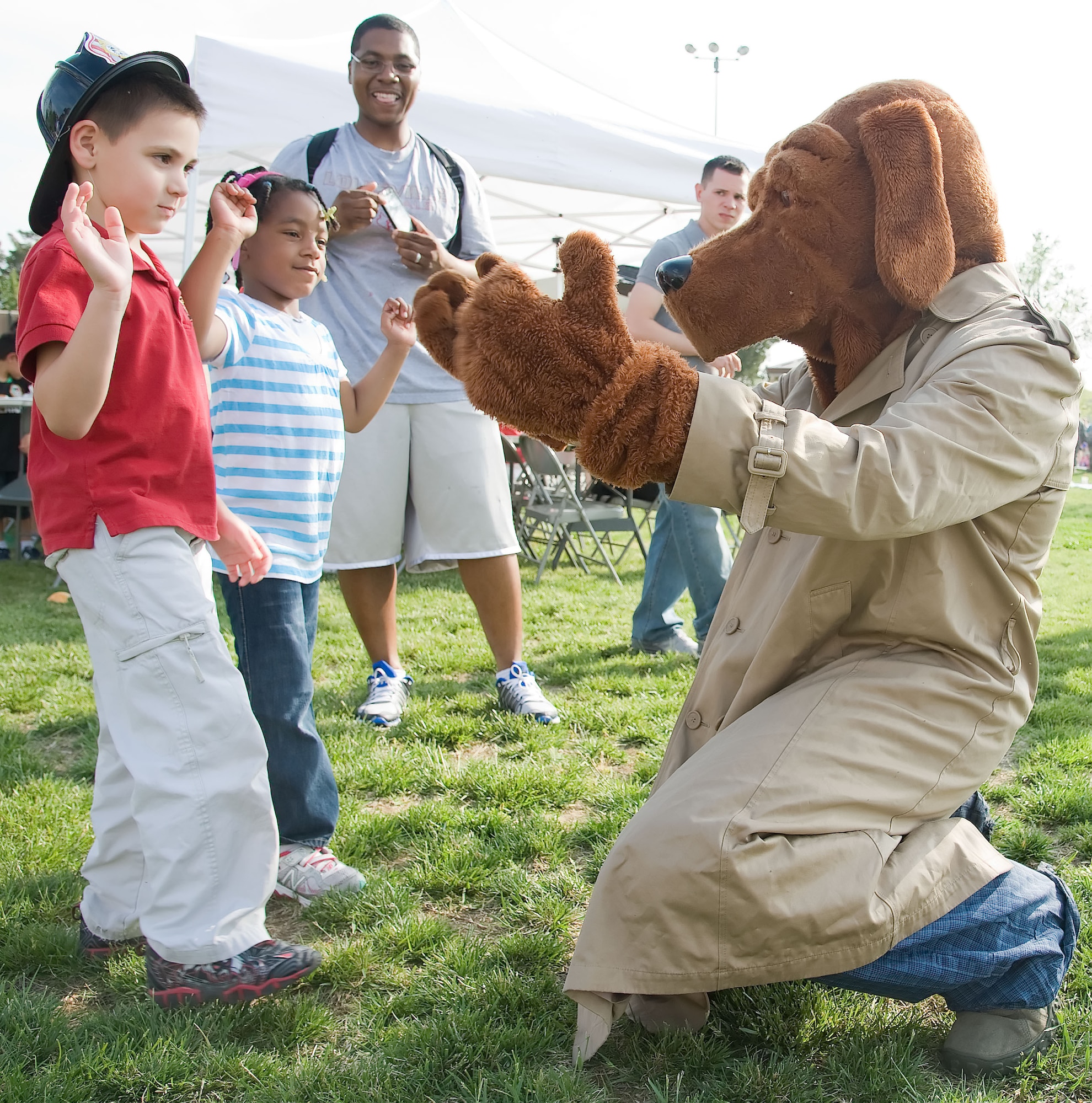 Children meet with McGruff the Crime Dog at the Family Picnic May 4, 2012, on Dover Air Force Base, Del. The picnic featured free food, a dunk tank, live music and games for Team Dover members to enjoy. (U.S. Air Force photo by Adrian R. Rowan)