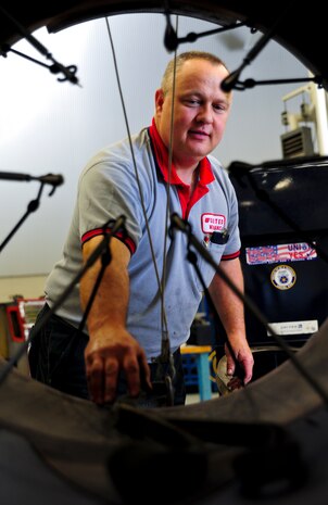 Danny Page assembles the core thrust reverser on an F-117 engine at Joint Base Charleston – Air Base May 3. Page served in the Air Force at Dover Air Force Base, Del., as a crew chief on a C-5 Galaxy. The F-117 engine is used on the C-17 Globemaster III. Page is a United Airlines aircraft maintenance technician. (U.S. Air Force photo/Airman 1st Class Dennis Sloan)