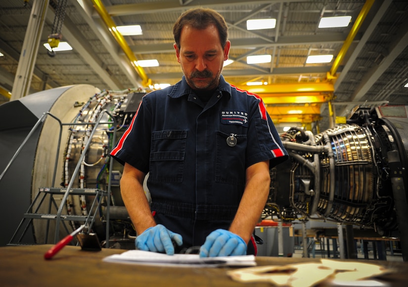 Jerry Zuk reviews an inspection checklist after removing several tags from an F-117 engine at Joint Base Charleston – Air Base May 3. Zuk, a retired Air Force crew chief, inspects the engine several times throughout the build-up process. Once the engine is inspected, tested and certified, it is installed on a C-17 Globemaster III. Zuk is a United Airlines F-117 engine inspector. (U.S. Air Force photo/Airman 1st Class Dennis Sloan)