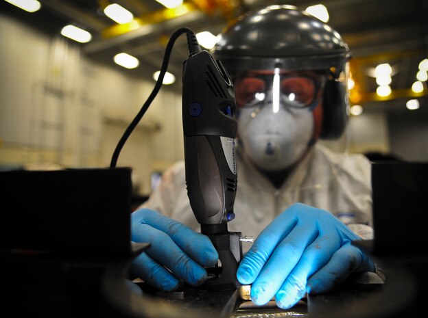 Steve Cadmus uses a ball rotary file at Joint Base Charleston – Air Base May 3 to modify a scallop ring so heat expansion will not cause cracking. Cadmus served in the Air Force for four years as an aircraft mechanic on C-5 Galaxys, C-141 Starlifters and F-4E Phantoms. He performs several modifications to the F-117 engine, which is later used on the C-17 Globemaster III. Cadmus is a United Airlines aircraft mechanic. (U.S. Air Force photo/Airman 1st Class Dennis Sloan)