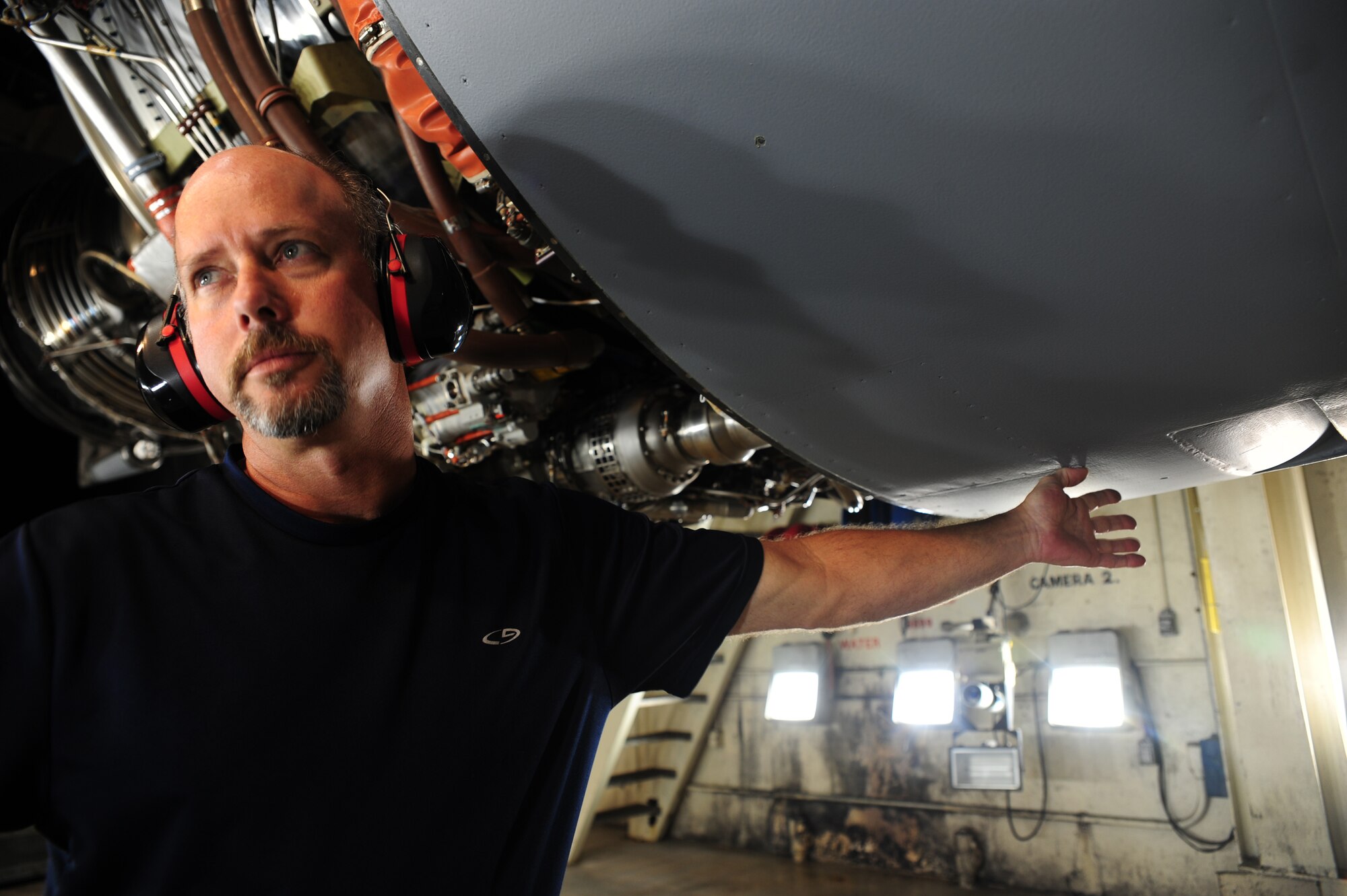Tim Gorman performs an anti-ice check on a C-17 Globemaster III engine at the engine test cell at Joint Base Charleston – Air Base May 3. The wire is connected to ensure temperature is regulated in the engine. Goreman is an aviation maintenance technician with United Airlines. (U.S. Air Force photo/Staff Sergeant Katie Gieratz)