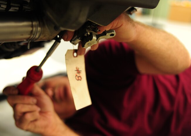 Corey Seeber repairs fireloop clamps on a C-17 Globemaster III engine at the Joint Base Charleston – Air Base engine shop May 2. The fireloop is used for warning pilots if there is a fire in an engine. Seeber is an aviation maintenance technician with United Airlines. (U.S. Air Force photo/Staff Sergeant Katie Gieratz)