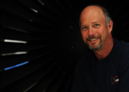 Tim Gorman stops for a photo in a C-17 Globemaster III engine inlet at the Joint Base Charleston – Air Base C-17 engine shop May 2. Goreman is an aviation maintenance technician with United Airlines. (U.S. Air Force photo/Staff Sergeant Katie Gieratz)