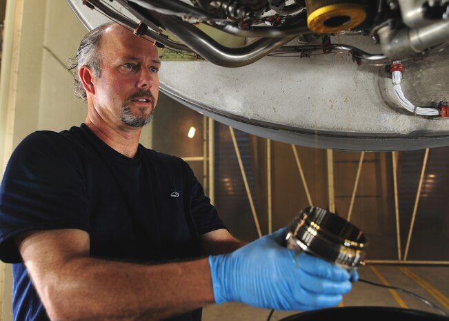 Tim Goreman checks an oil filter on a C-17 Globemaster III engine at the Joint Base Charleston – Air Base engine test cell May 3. The all-civilian engine shop installs, inspects and repairs five to six engines a month. Goreman is an aviation maintenance technician with United Airlines. (U.S. Air Force photo/Staff Sergeant Katie Gieratz)