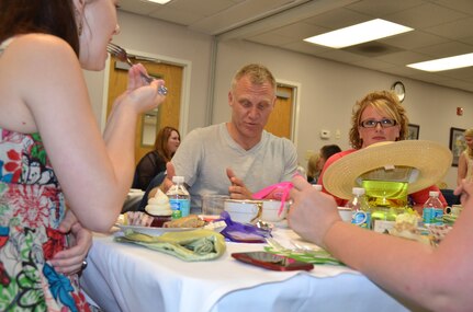 Terry Serpico has tea with military spouses at the Joint Base Charleston - Air Base Airman and Family Readiness Center, May 5. Serpico is an actor on Lifetime Network's television series, "Army Wives" and for the last five seasons has played the role of Army Lt. Col. Frank Sherwood. The spouses were being honored as part of Military Spouse Appreciation Day which included massages, hair styling salon, tea and other events. The sixth season of "Army Wives" premiered May 1 on the Lifetime Network and the majority of the show is filmed in North Charleston, S.C. (U.S. Air Force Photo / Airman 1st Class Tom Brading)