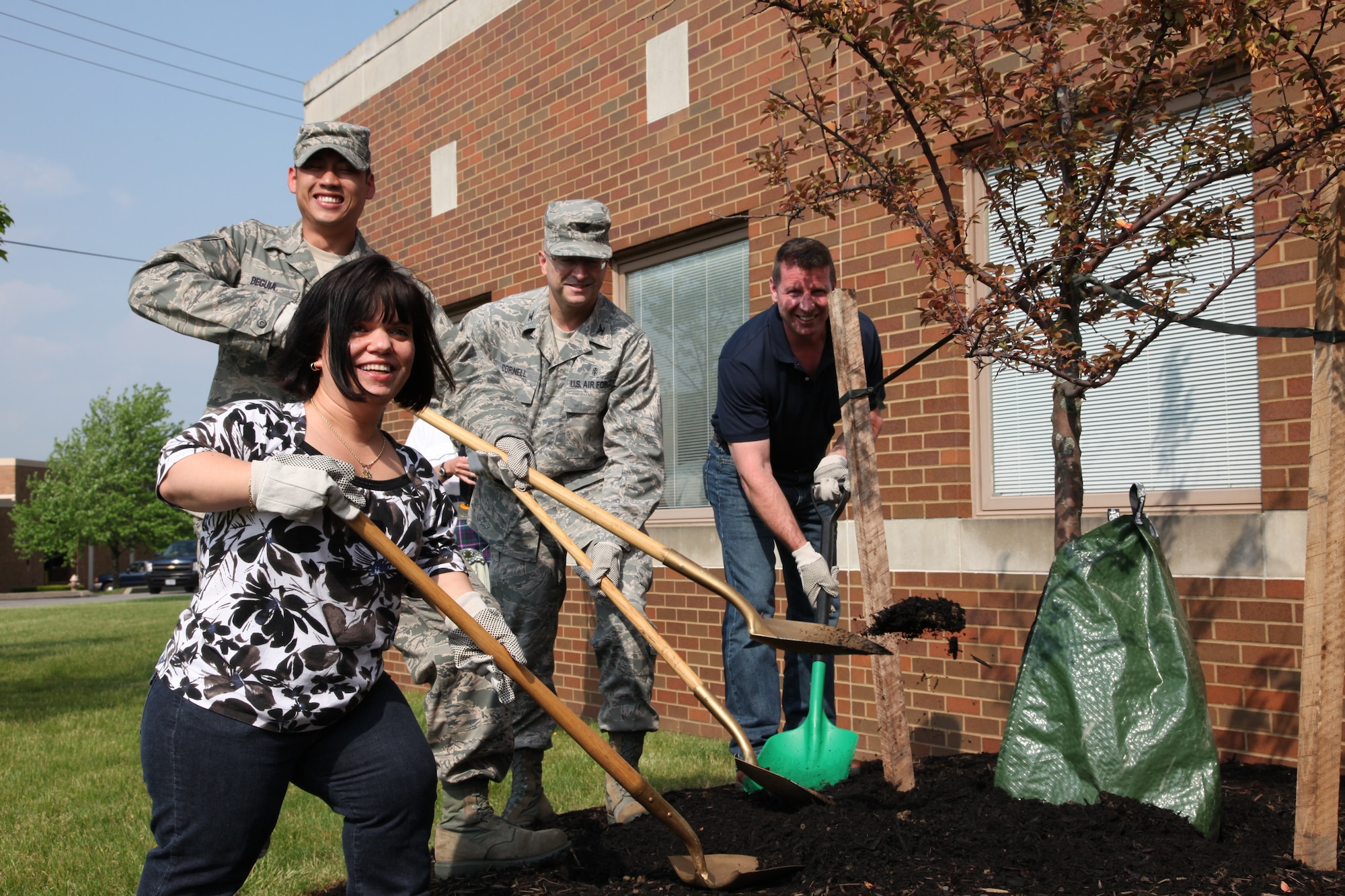 Military and civilian members from the 911th Airlift Wing plant a tree in front of building 220 in support of Earth Day, here, May 3, 2012. Earth Day is an annual day on which events are held worldwide to increase alertness and appreciation of the Earth’s natural environment; consequently it serves as a reminder of the Air Force’s commitment to leadership in environmental management.  In 2012, the Air Force is renewing their commitment to “Win the War against Waste” and has revived the P2 Program, a pollution prevention plan, with this year’s slogan, “Conserve Today – Secure Tomorrow – Blue Acts of Green.” To remember Earth Day each year, the 911th Airlift Wing plants a tree to symbolize and pledge to environmental stewardship.  We encourage everyone to take this opportunity to renew their own commitment to improving the environment in which you work and live. (U.S. Air Force photo by Tech. Sgt. Ralph Van Houtem/ Released)
