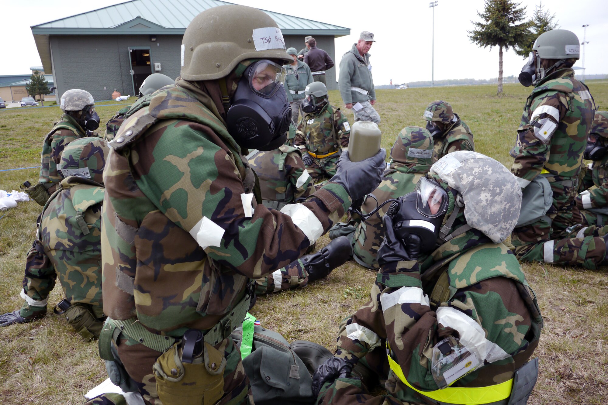 WRIGHT-PATTERSON AIR FORCE BASE, Ohio – Tech. Sgt. Brent Pemberton, 445th Airlift Wing orderly room, and Master Sgt. Cindy Hall, 445th Airlift Wing Judge Advocate office, demonstrate team work while hydrating during the operational readiness exercise at Volk Field Air National Guard Base, Wis., April 25. (U.S. Air Force photo/Maj. Jose Cardenas)