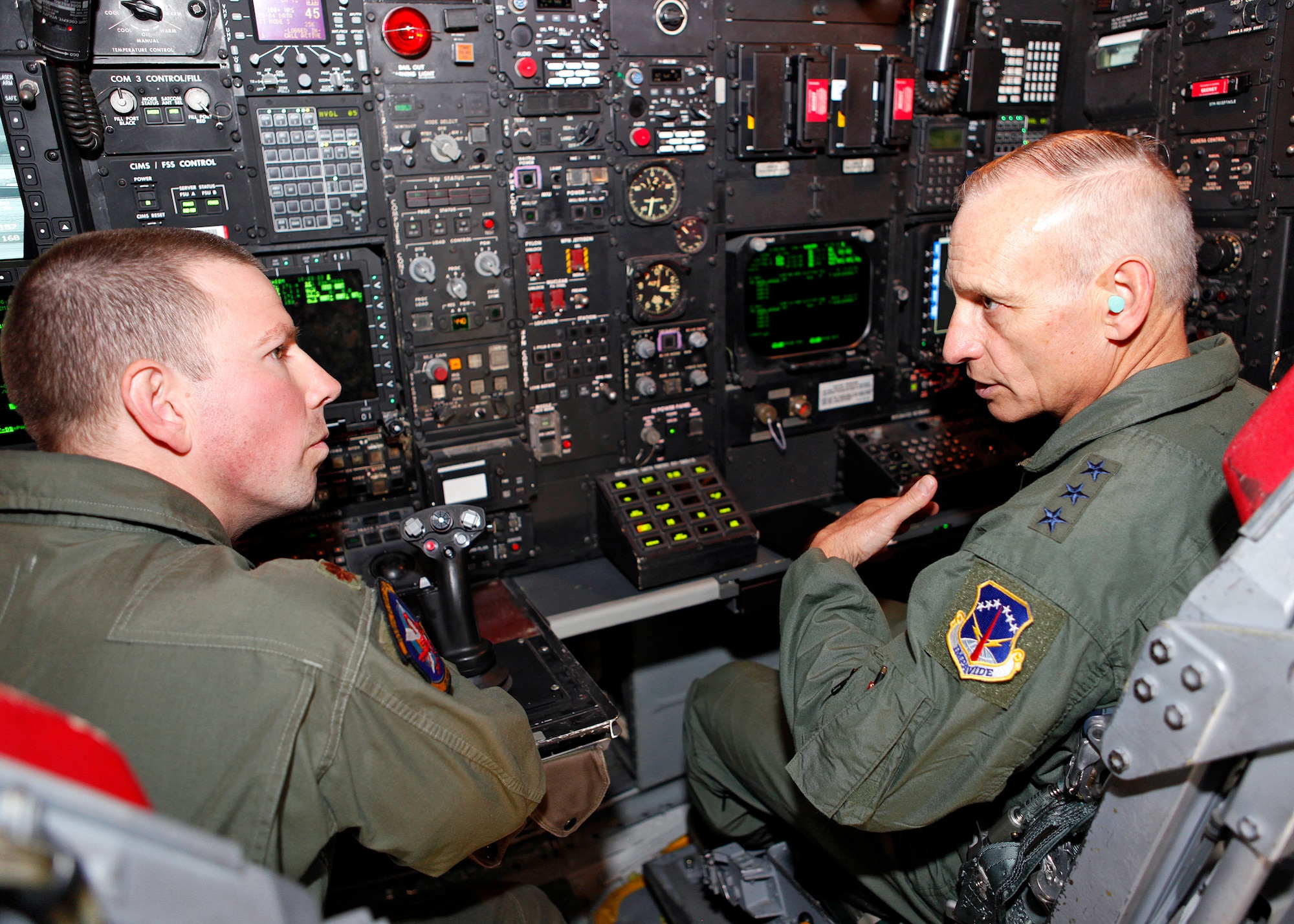 (Left) Maj. Jonathan Beich, 419th Flight Test Squadron assistant director of operations, and Lt. Gen. James Kowalski, commander of Air Force Global Strike Command, prepare to go through a demonstration of the new Combat Network Communications Technology modification inside an Edwards B-52 May 2. Aside from visiting Edwards Air Force Base, Calif., General Kowalski also had an opportunity to visit to Lockheed Martin's Advanced Development Programs facility in Palmdale, Calif. (U.S. Air Force photo by Jet Fabara)