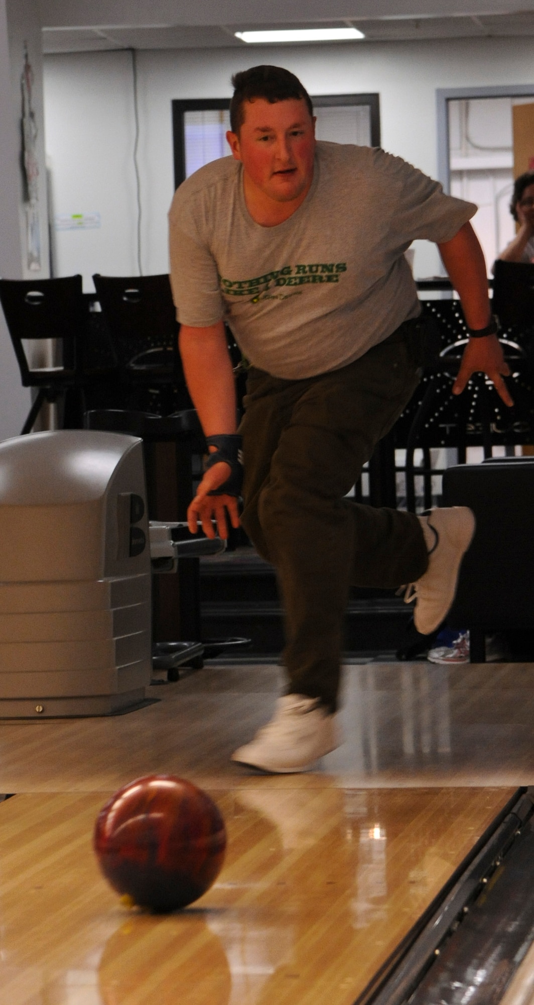 Chris Ferri bowls during a "Can Doers Bowling League" game May 5, 2012, at the Eagle Lanes Bowling Center on Dover Air Force Base, Del. The "Can Doers Bowling League" is comprised of military dependants who have intellectual or physical disabilities. (U.S. Air Force photo by Senior Airman Matthew Hubby)