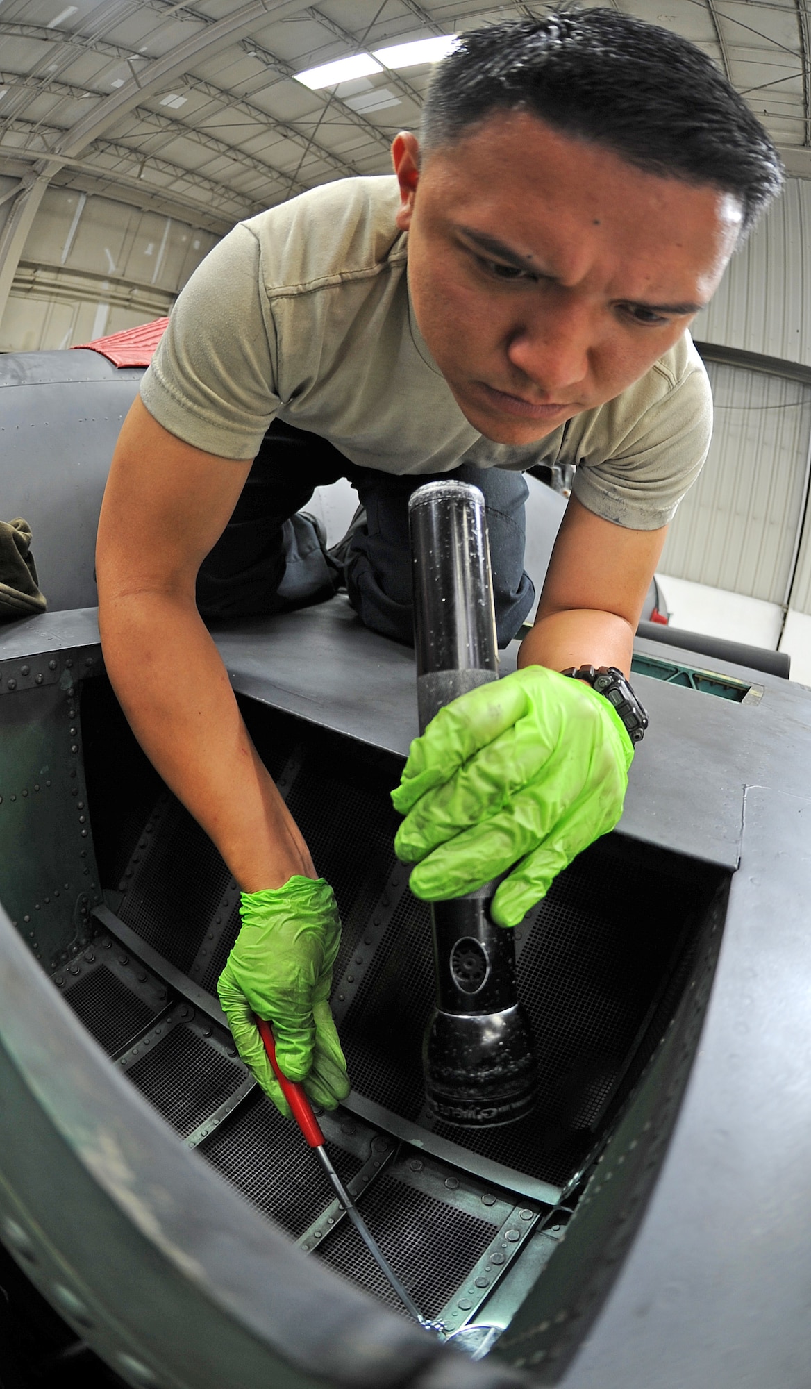 U.S. Air Force Airman 1st Class Sean Gonzales inspects the inside of an F-15E Strike Eagle for debris during an hourly post-phase inspection on Seymour Johnson Air Force Base, N.C., May 7, 2012. Debris must be removed from inside the aircraft to prevent it from getting into the engine and causing serious damage. Gonzales, 4th Equipment Maintenance Squadron crew chief, hails from La Palma, Calif. (U.S. Air Force photo/Senior Airman Gino Reyes/Released)