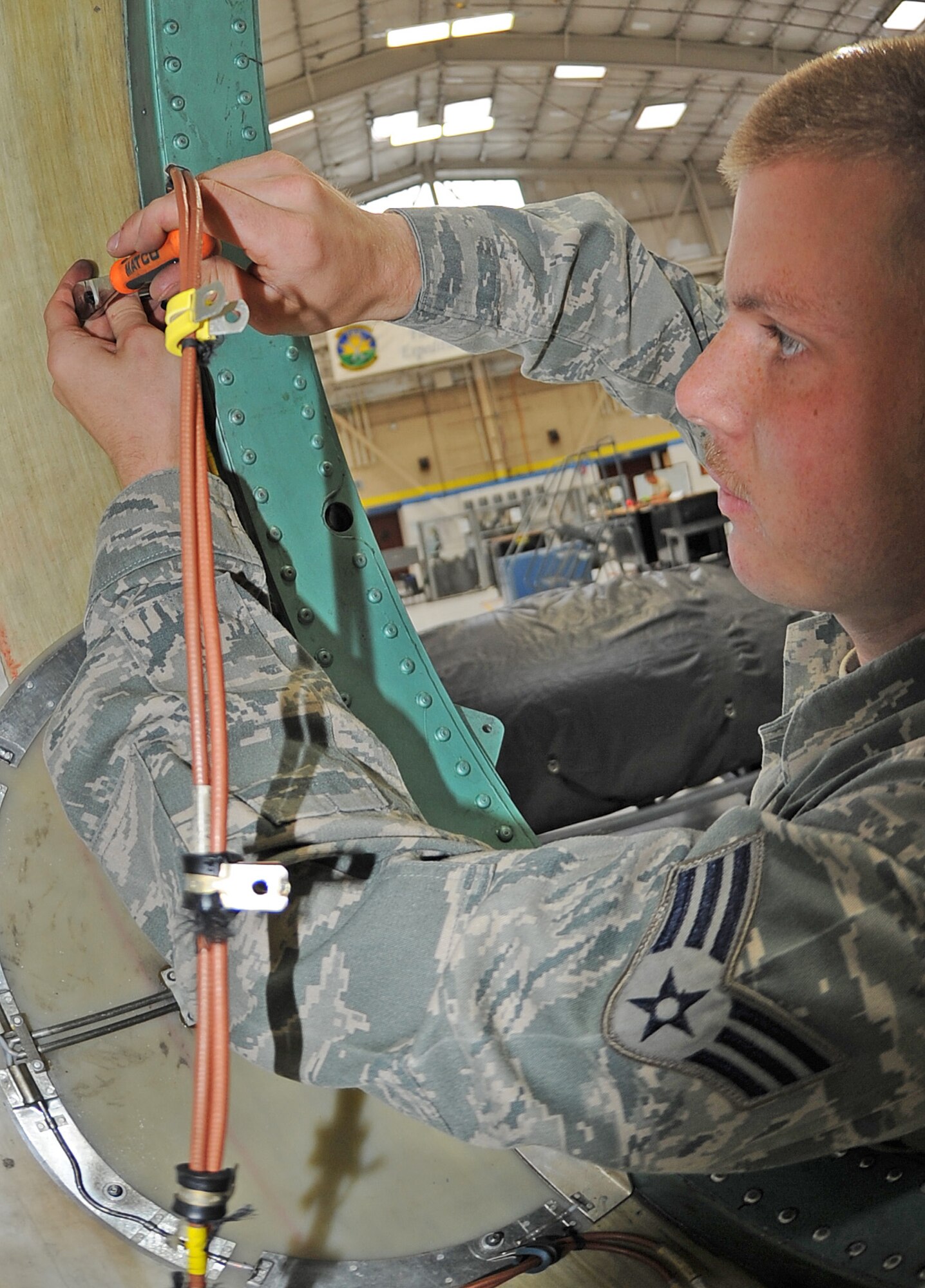 U.S. Air Force Senior Airman Nathan Lewellen installs an Instrument Landing System antenna on an F-15E Strike Eagle during an hourly post-phase inspection on Seymour Johnson Air Force Base, N.C., May 7, 2012. The ILS antenna is used to assist aircrew with landing. If the aircrew cannot see, the system will let them know if the aircraft is lined up properly for landing. Lewellen, 335th Aircraft Maintenance Unit avionics technician, hails from Oak Hill, Ohio. (U.S. Air Force photo/Senior Airman Gino Reyes/Released)