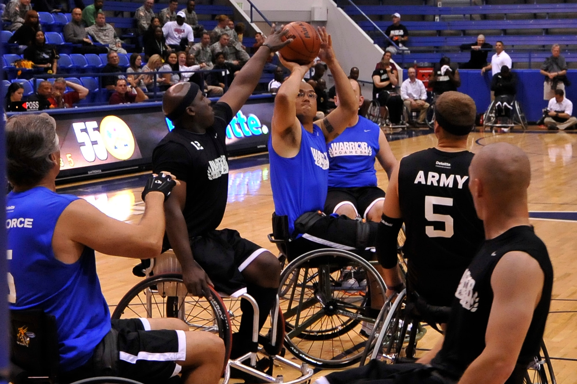 Master Sgt. Christopher Aguilera pulls up for a shot against the U.S.Army
during a Warrior Games wheelchair basketball contest at the U.S. Air Force Academy, Colo., May 2, 2012. The Warrior Games provides a springboard for wounded veterans and service members to compete in Paralympic sports against other U.S. services. (U.S. Air Force photo/Staff Sgt. Christopher Boitz)
