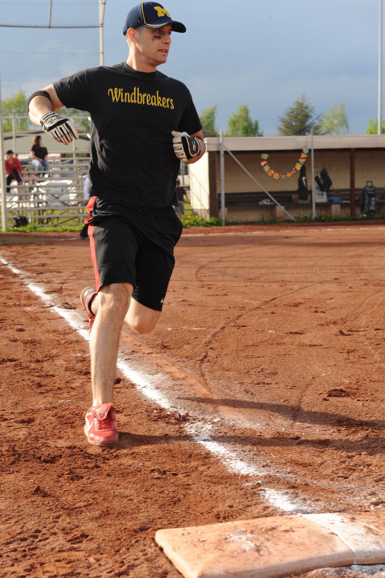 SPANGDAHLEM AIR BASE, Germany –Nicholas McDonald, 31st Munitions Support Squadron from Aviano AB, Italy, runs to first base during a double elimination Cinco de Mayo softball tournament here May 4. The Royal Air Force Lakenheath, England, team beat the Aviano AB team with a final score of 16 - 6 in the first game of the tournament. The varsity Sabers softball teams hosted the event to raise funds for future tournaments. Ramstein AB took first place overall by beating another team from Ramstein with a score of 36 - 25.  (U.S. Air Force photo by Senior Airman Christopher Toon/Released)

