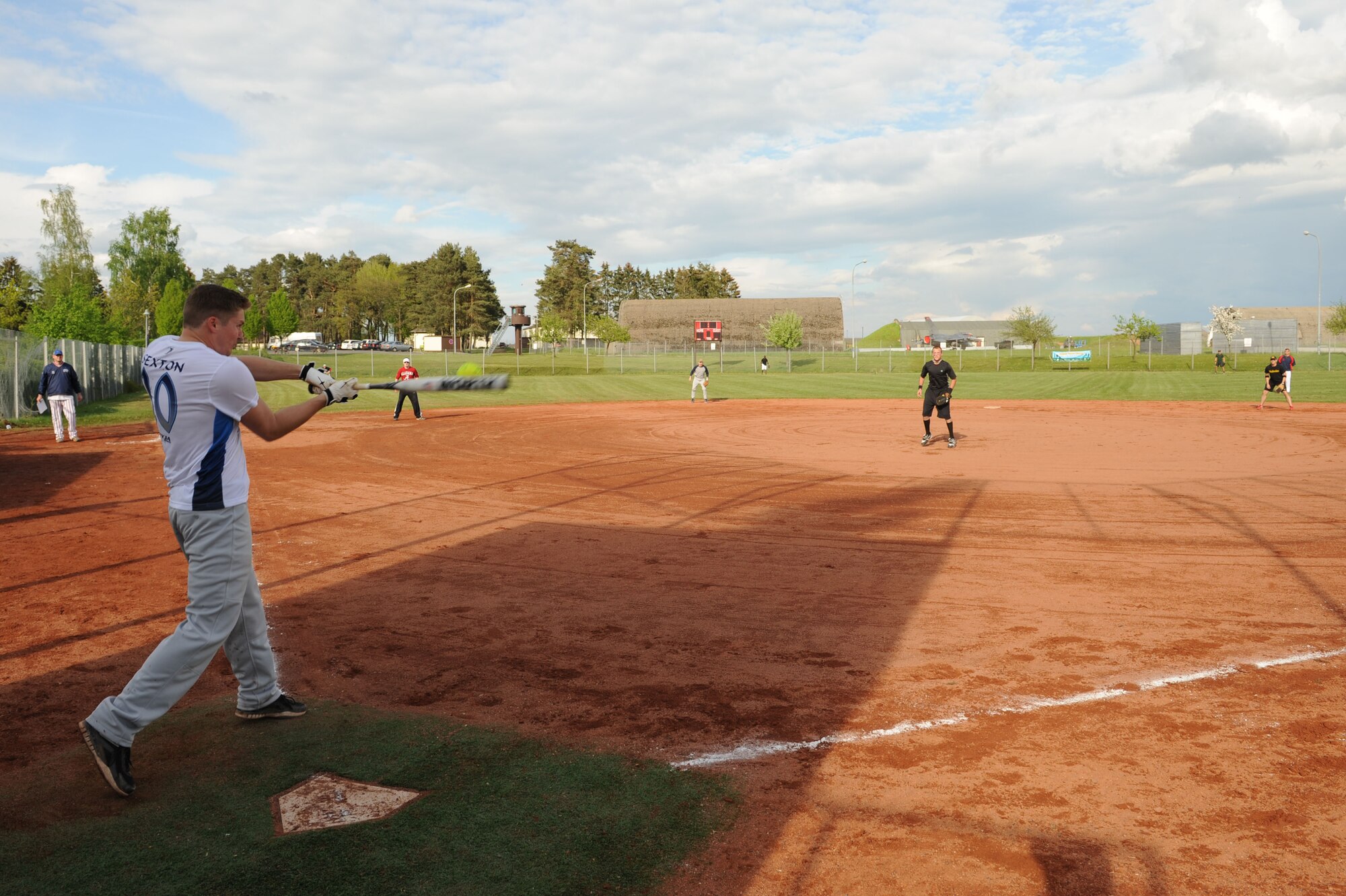 SPANGDAHLEM AIR BASE, Germany – Broderick Morris, 52nd Logistics Readiness Squadron member and substitute player for Royal Air Force Lakenheath, England, hits a ball during a double elimination Cinco de Mayo softball tournament here May 4. The RAF Lakenheath team beat the Aviano AB, Italy, team with a final score of 16 - 6 in the first game of the tournament. The varsity Sabers softball teams hosted the event to raise funds for future tournaments. Ramstein AB took first place overall by beating another team from Ramstein with a score of 36 - 25.  (U.S. Air Force photo by Senior Airman Christopher Toon/Released)