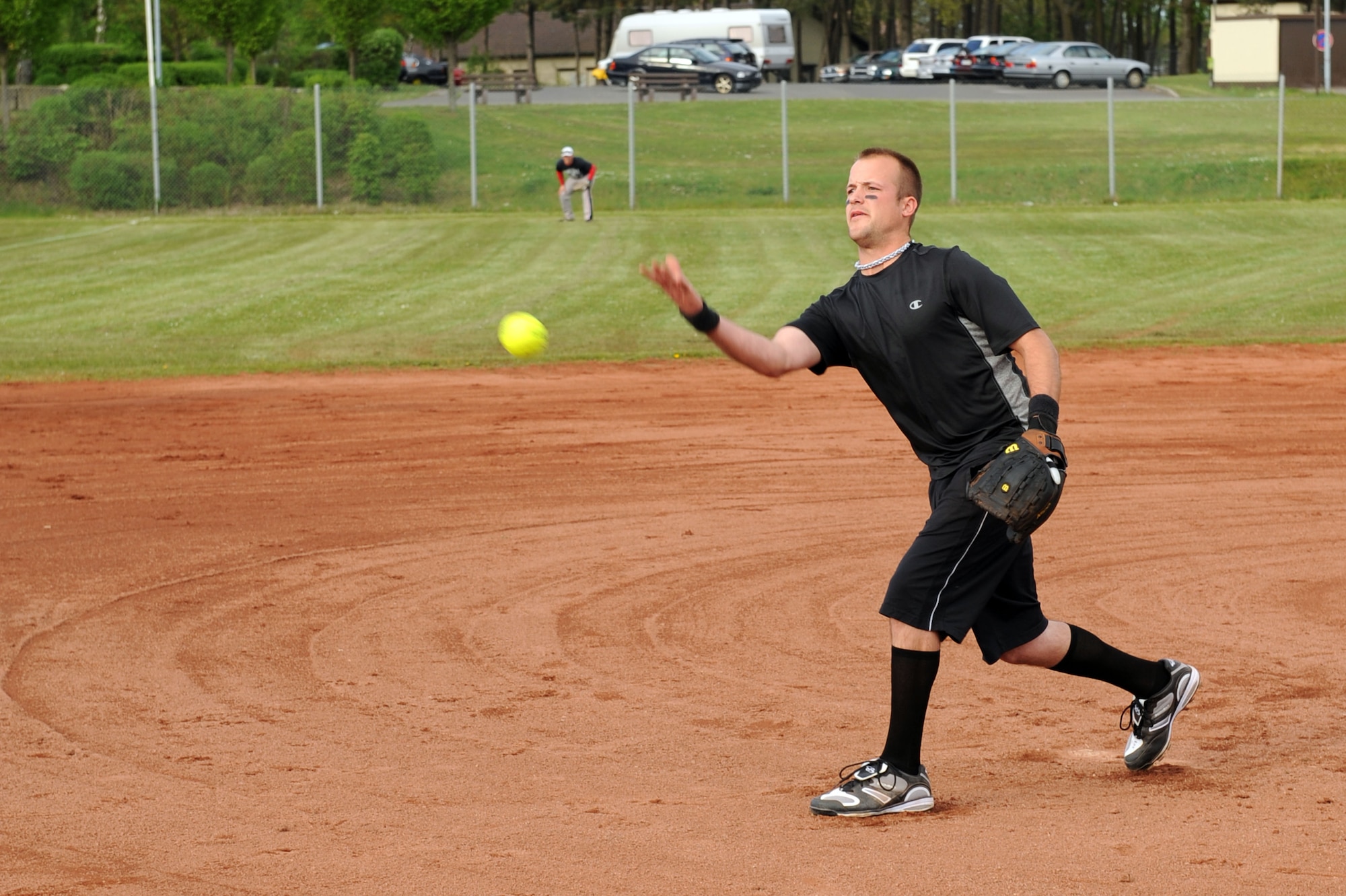 SPANGDAHLEM AIR BASE, Germany – Tyler Wilkins, 31st Aircraft Maintenance Squadron from Aviano AB, Italy, pitches during a double elimination Cinco de Mayo softball tournament here May 4. The Royal Air Force Lakenheath, England, team beat the Aviano AB, team with a final score of 16 - 6 in the first game of the tournament. The varsity Sabers softball teams hosted the event to raise funds for future tournaments. Ramstein AB took first place overall by beating another team from Ramstein with a score of 36 - 25.  (U.S. Air Force photo by Senior Airman Christopher Toon/Released)