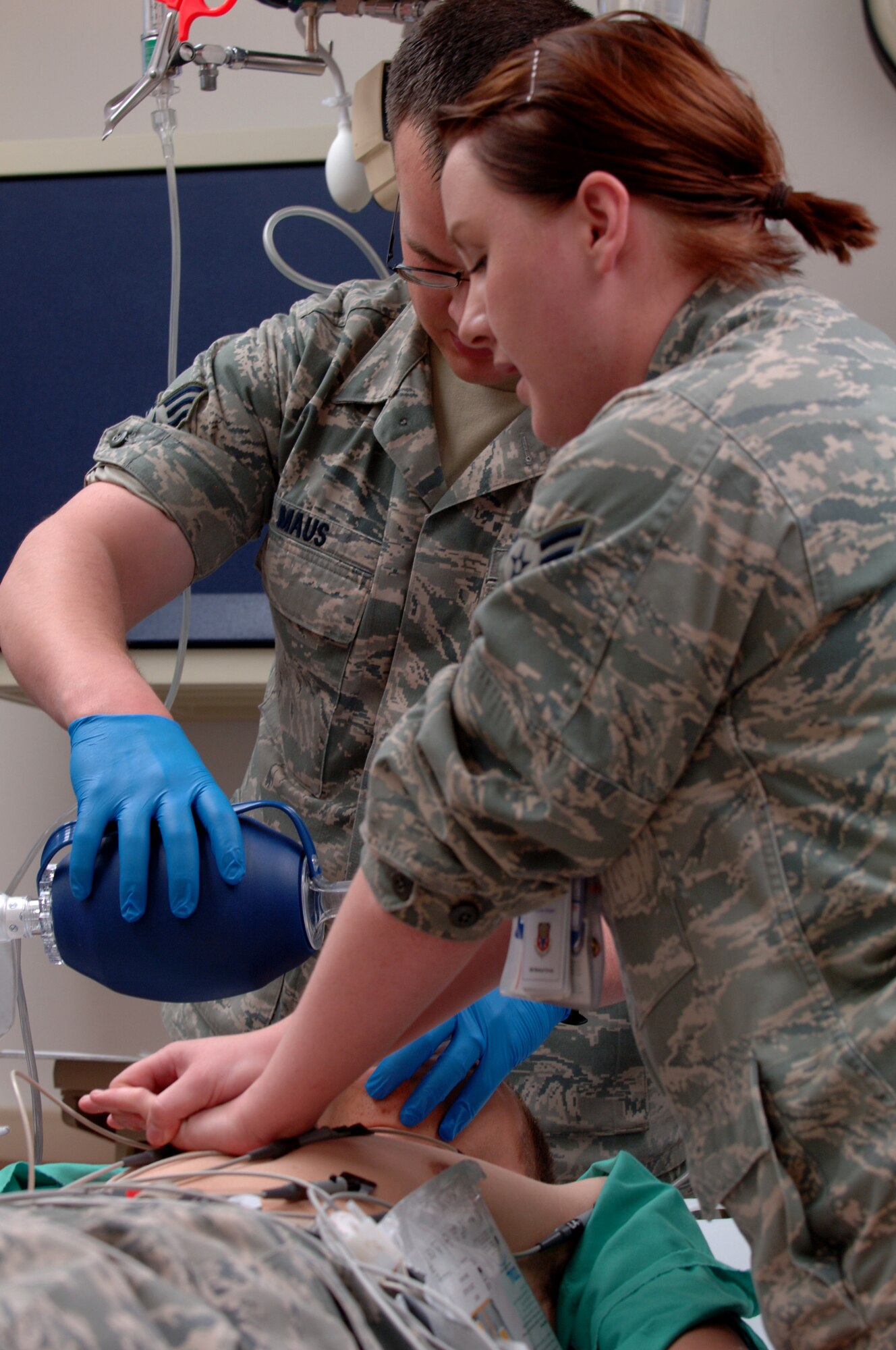 Members of the night-shift in the Urgent Care Center tend to a patient during a training exercise, May 1, 2012, at Mountain Home Air Force Base, Idaho. In an effort to uphold their commitment to the Air Force, these Airmen have altered their natural rest cycles, working from 7 p.m. to 7 a.m. (U.S. Air Force photo/Airman 1st Class Shane M. Phipps)