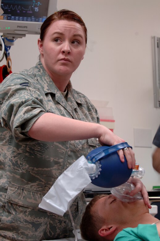 U.S. Air Force Airman 1st Class Lyndsi Skipper, 366th Medical Group technician, listens attentively to a superior while monitoring a patient during a training exercise, May 1, 2012, at Mountain Home Air Force Base, Idaho. Many men and women operating and supporting the Urgent Care Center continue their duties throughout the dead of night. (U.S. Air Force photo/Airman 1st Class Shane M. Phipps)