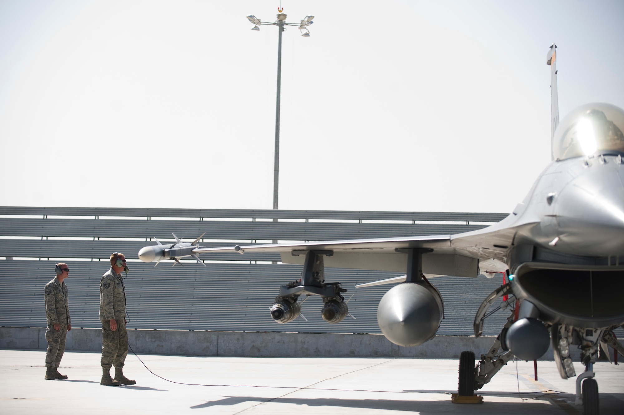 U.S. Air Force Staff Sgt. Anthony Noesen and Staff Sgt. Jared Newman with the 451st Expeditionary Aircraft Maintenance Squadron, perform final checks and engine start-up on an F-16C, Kandahar Airfield, Afghanistan, April 5, 2012. The mission of the 451st EAMXS is to provide their aircraft with efficient maintenance support in order to deliver decisive airpower for Operation Enduring Freedom. (U.S. Air Force photo/Staff Sgt. Greg Biondo)
