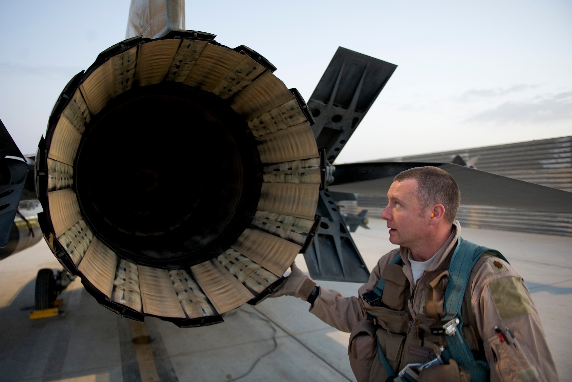 U.S. Air Force Maj. Chad Lewis, an F-16C pilot with the 451st Expeditionary Fighter Squadron, performs pre-flight checks on his aircraft, Kandahar Airfield, Afghanistan, April 3, 2012. The mission of the 451st EFS is to deliver decisive airpower on target, on time. (U.S. Air Force photo/Staff Sgt. Greg Biondo)
