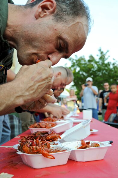 Col. Keith Teister, 608th Air Operations Center, eats crawfish during an eating contest at the 2012 Crawfish Festival on Barksdale Air Force Base, La., May 4. The festival held eating contests for both kids and adults. The winner for the children's contest won a 26-inch television and the winner of the adults' contest won a 46-inch television. (U.S. Air Force photo/Airman 1st Class Micaiah Anthony)(RELEASED) 