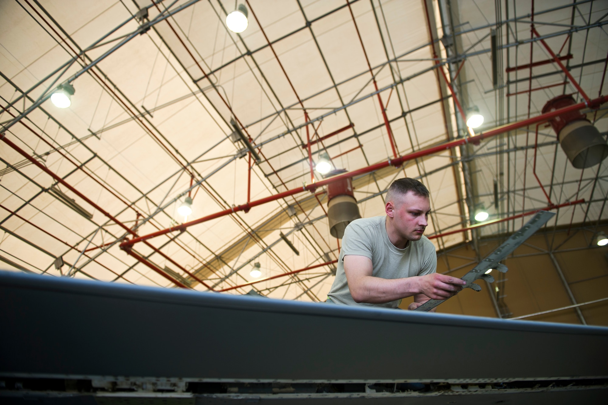 U.S. Air Force Senior Airman Joshua Douglas, a native of Des Moines, Iowa and mechanic for the 451st Expeditionary Maintenance Squadron, works on an F-16C Fighting Falcon, April 2, 2012, at Kandahar Airfield Afghanistan. The mission of the 451st EMXS is to proactively maintain F-16C Fighting Falcons here. (U.S. Air Force photo/Staff Sgt. David Salanitri)