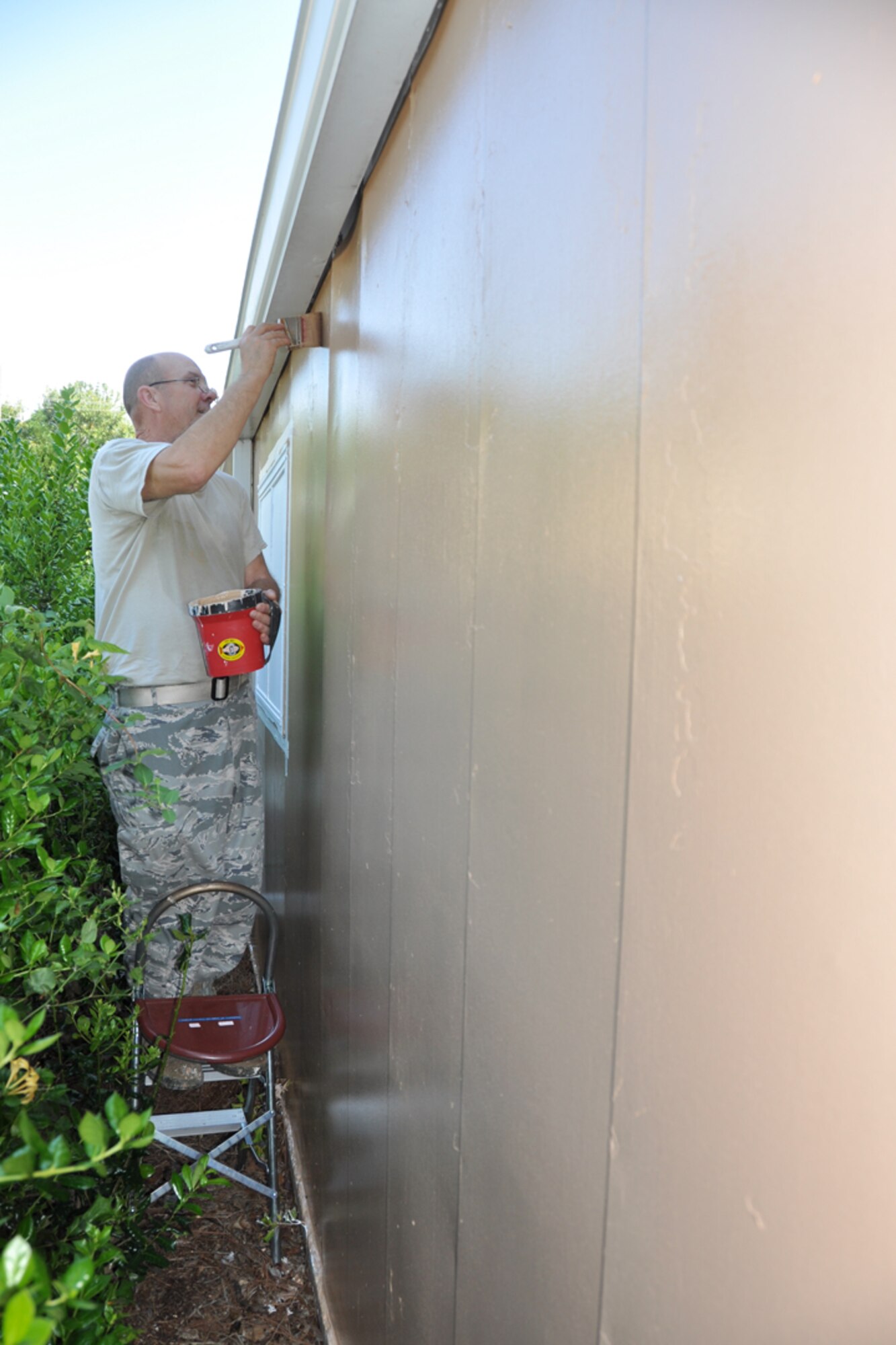 Staff Sgt Mike Johnson, 94th Civil Engineering Squadron structural journeymen, applies a second coat of paint onto the Dobbins Thrift Shop, May 5, as part of a renovation project. Established 28 years ago, the Dobbins Thrift Store is open every Thursday and Unit Training Assembly Saturday, 10 a.m. to 3 p.m. for purchases and donations. (U.S. Air Force photo/Senior Airman Chelsea Smith)