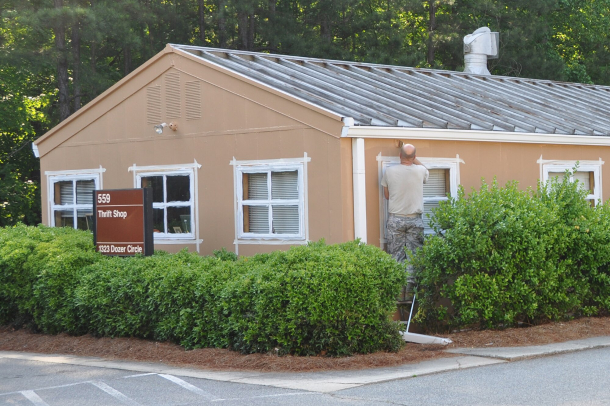 Staff Sgt Mike Johnson, 94th Civil Engineering Squadron structural journeymen, applies a second coat of paint onto the Dobbins Thrift Shop, May 5, as part of a renovation project. Established 28 years ago, the Dobbins Thrift Store is open every Thursday and Unit Training Assembly Saturday, 10 a.m. to 3 p.m. for purchases and donations. (U.S. Air Force photo/Senior Airman Chelsea Smith)