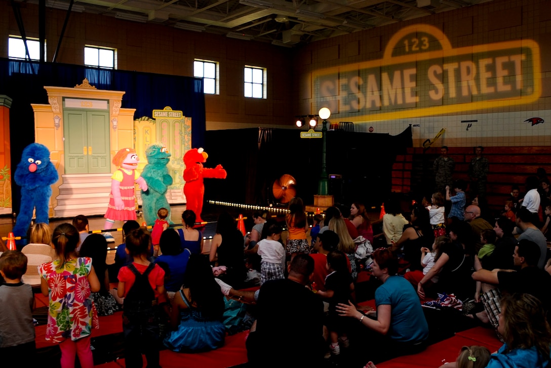 Families from Langley Air Force Base, Va., attend the 2011 Joining Forces: Sesame Street and USO Special Event show at the base youth center, May 7, 2012. The cast, which featured many popular characters, performed four shows for military families, May 7 and 8. (U.S. Air Force photo by Senior Airman Wesley Farnsworth/Released)