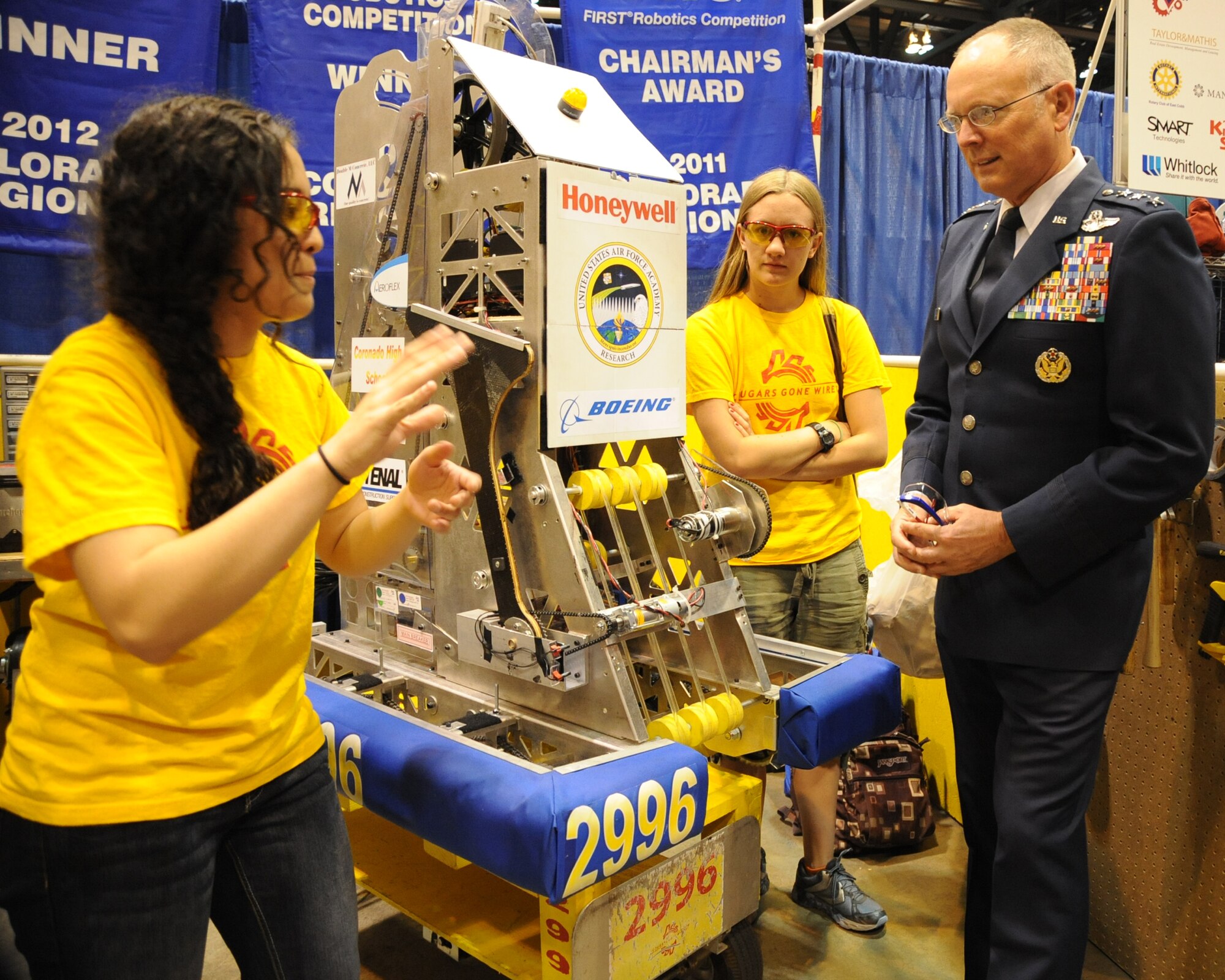 Jasmine Kemble, a senior at Coronado High School in Colorado Springs, Colo. explains to Lt. Gen. Robert Allardice, Air Mobility Command vice commander, how their robot performs during the For Inspiration and Recognition of Science and Technology World Championship in St. Louis on April 27, 2012.  (U.S. Air Force photo/Senior Master Sgt. Rob Wieland)