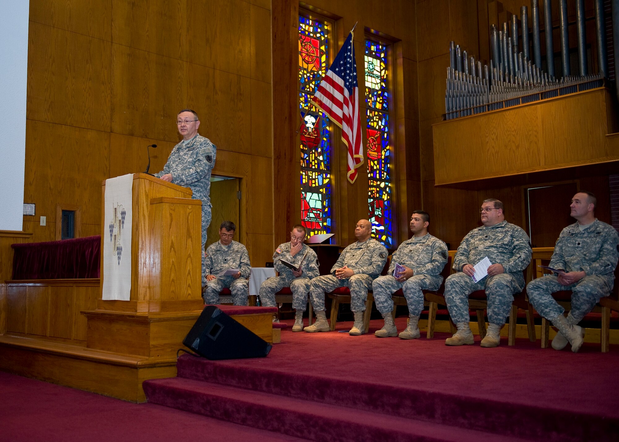 U.S. Army Chap. (Col.) Kenneth Bush, 633rd Air Base Wing deputy chaplain, greets the congregation during the National Day of Prayer celebration at the Regimental Memorial Chapel at Fort Eustis, Va., May 3, 2012. This year marks the 61st annual observance of the National Day of Prayer, which occurs every year on the first Thursday in May. (U.S. Air Force photo by Senior Airman John D. Strong II/Released)