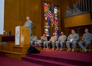 U.S. Army Chap. (Col.) Kenneth Bush, 633rd Air Base Wing deputy chaplain, greets the congregation during the National Day of Prayer celebration at the Regimental Memorial Chapel at Fort Eustis, Va., May 3, 2012. This year marks the 61st annual observance of the National Day of Prayer, which occurs every year on the first Thursday in May. (U.S. Air Force photo by Senior Airman John D. Strong II/Released)