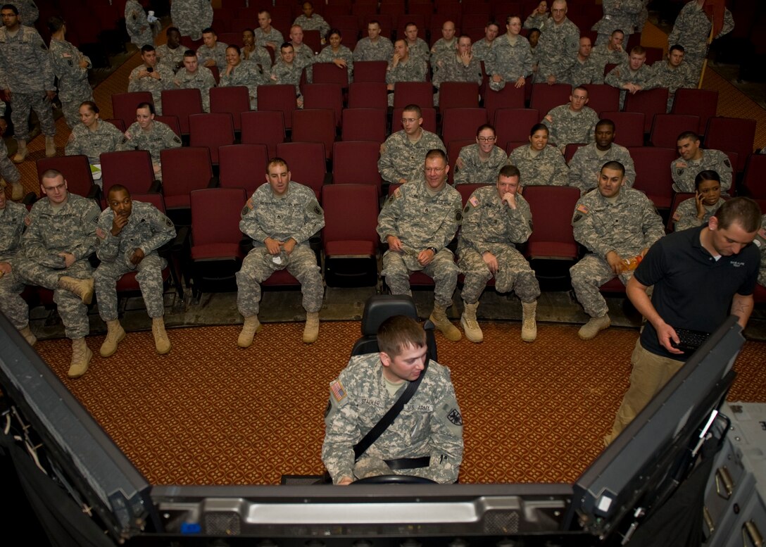 U.S. Army Spc. Steven Saddler, 7th Sustainment Brigade, tries his luck in the drunk driving simulator during the Save-a-Life Tour presentation at Fort Eustis' Jacobs Theater May 3, 2012. The Save-a-Life Tour visited Eustis to highlight the dangers of drinking and driving through graphic accident footage, gripping testimonials and drunk driving simulators. (U.S. Air Force photo by Senior Airman John D. Strong II/Released)