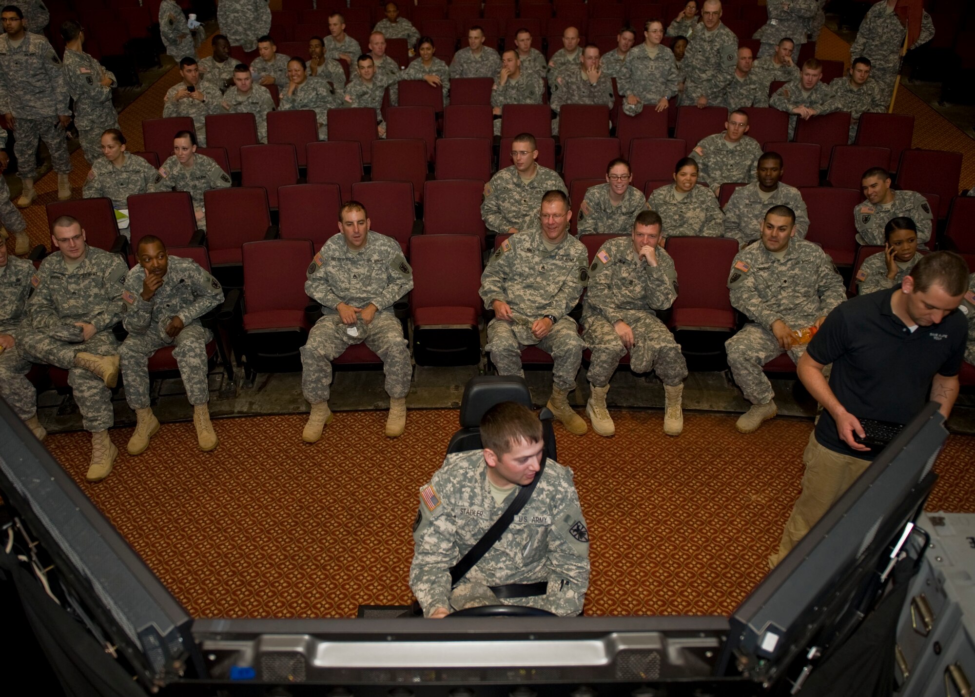 U.S. Army Spc. Steven Saddler, 7th Sustainment Brigade, tries his luck in the drunk driving simulator during the Save-a-Life Tour presentation at Fort Eustis' Jacobs Theater May 3, 2012. The Save-a-Life Tour visited Eustis to highlight the dangers of drinking and driving through graphic accident footage, gripping testimonials and drunk driving simulators. (U.S. Air Force photo by Senior Airman John D. Strong II/Released)