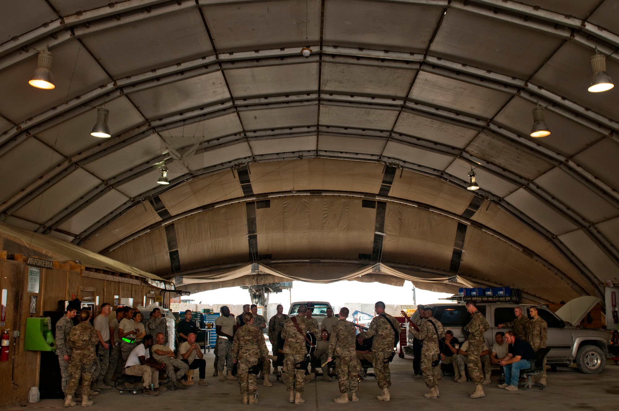 The U.S. Air Forces Central Band Nightwing plays for vehicle operations Airmen and civilians, May 2, 2012 at Kandahar Airfield Afghanistan. During their tour, the band likes to play for Airmen at their work centers. (U.S. Air Force photo by Staff Sgt. David Salanitri/Released)