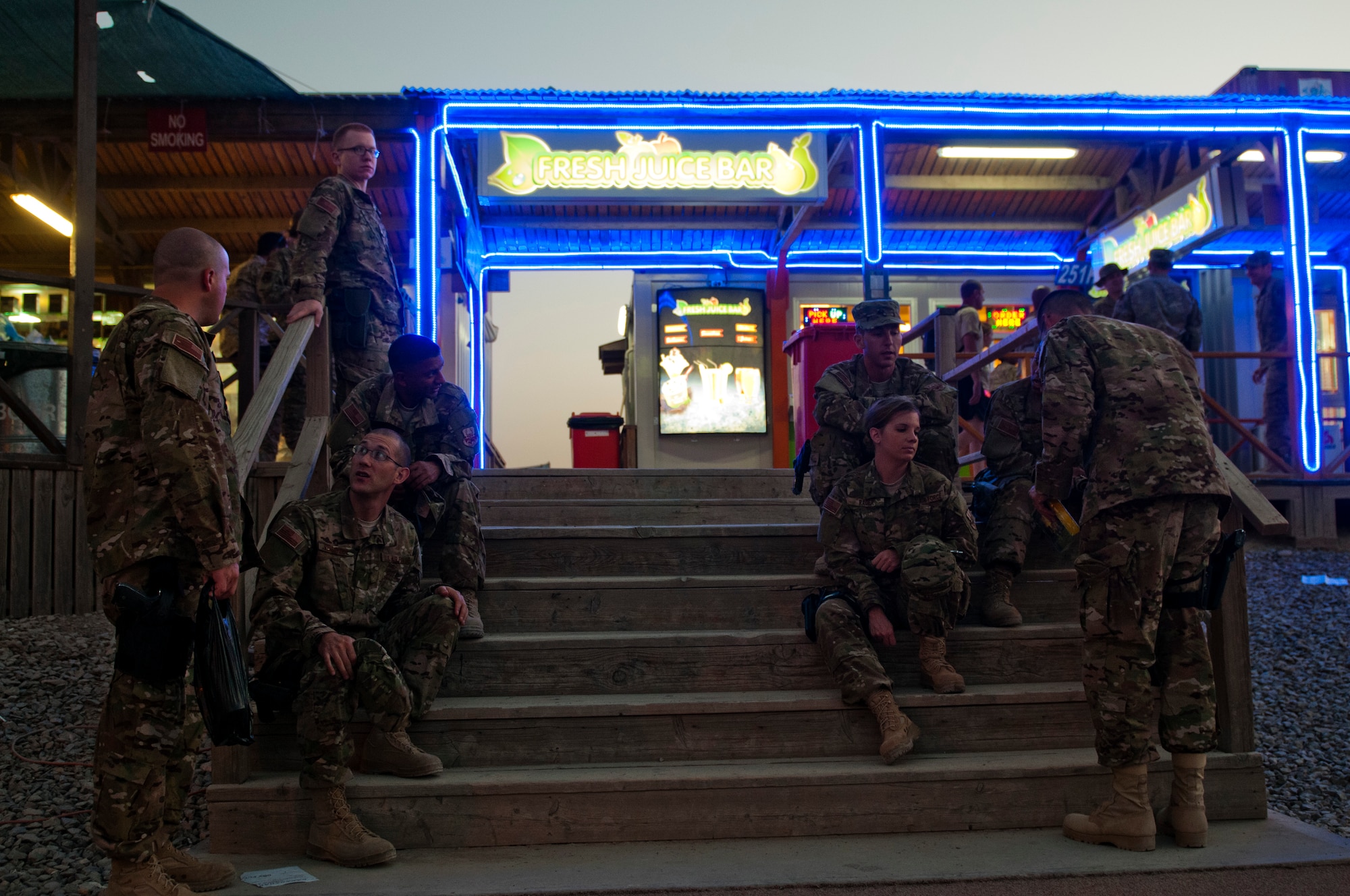 Members of the U.S. Air Forces Central Band Nightwing hang out at the "Boardwalk" May 1, 2012 at Kandahar Airfield, Afghanistan. The band played for nearly 2,000 people in their three nights here. (U.S. Air Force photo by Staff Sgt. David Salanitri/Released)